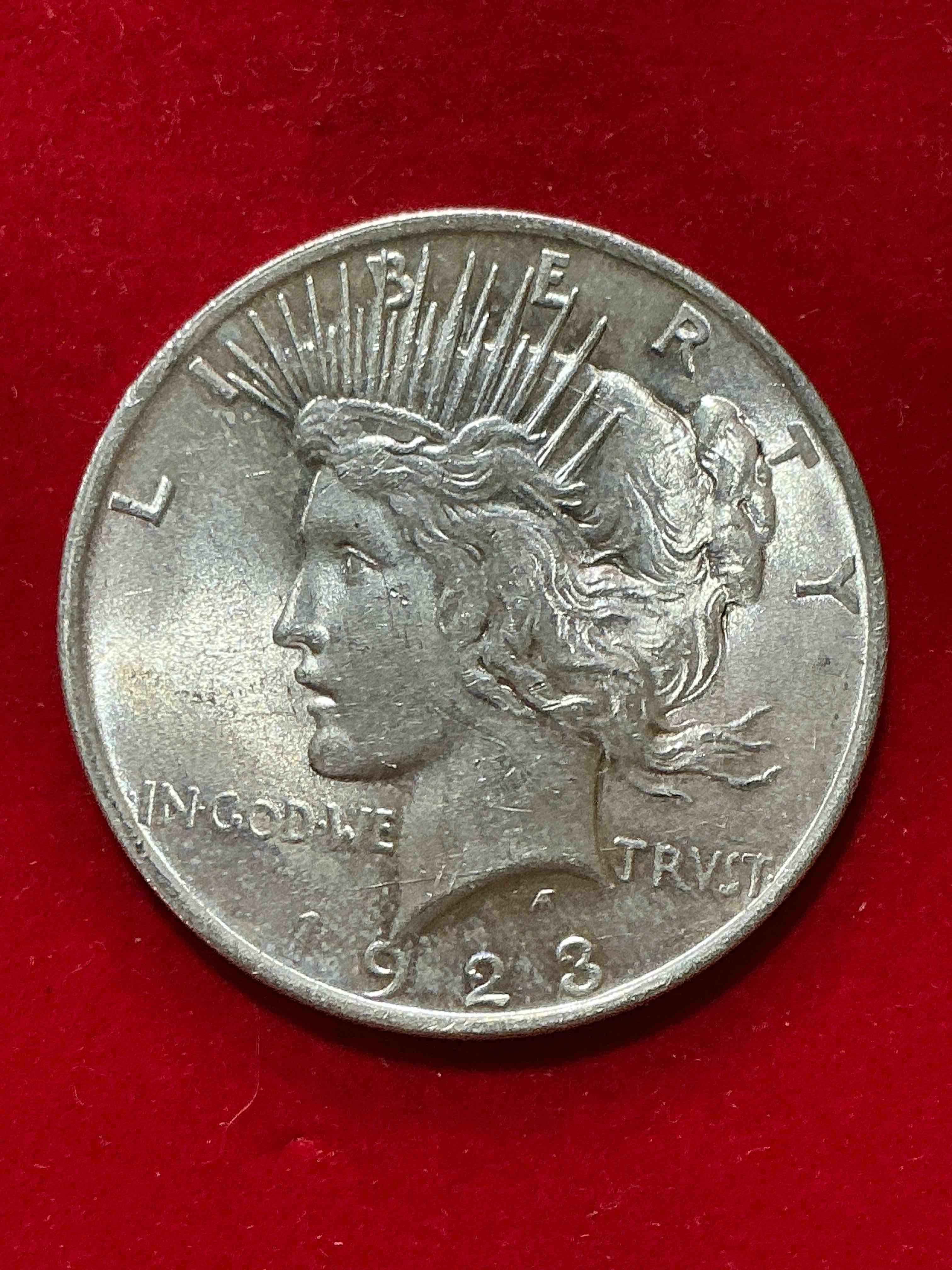 silver peace dollar! one dollar coin from 1923! these one ounce coins are 90% silver & super rare! liberty peace dollars are highly coveted by collectors for their value & beautiful design. add a one ounce liberty peace dollar at 90% silver to your collection! super rare! (dime in picture used for size reference only, not included)