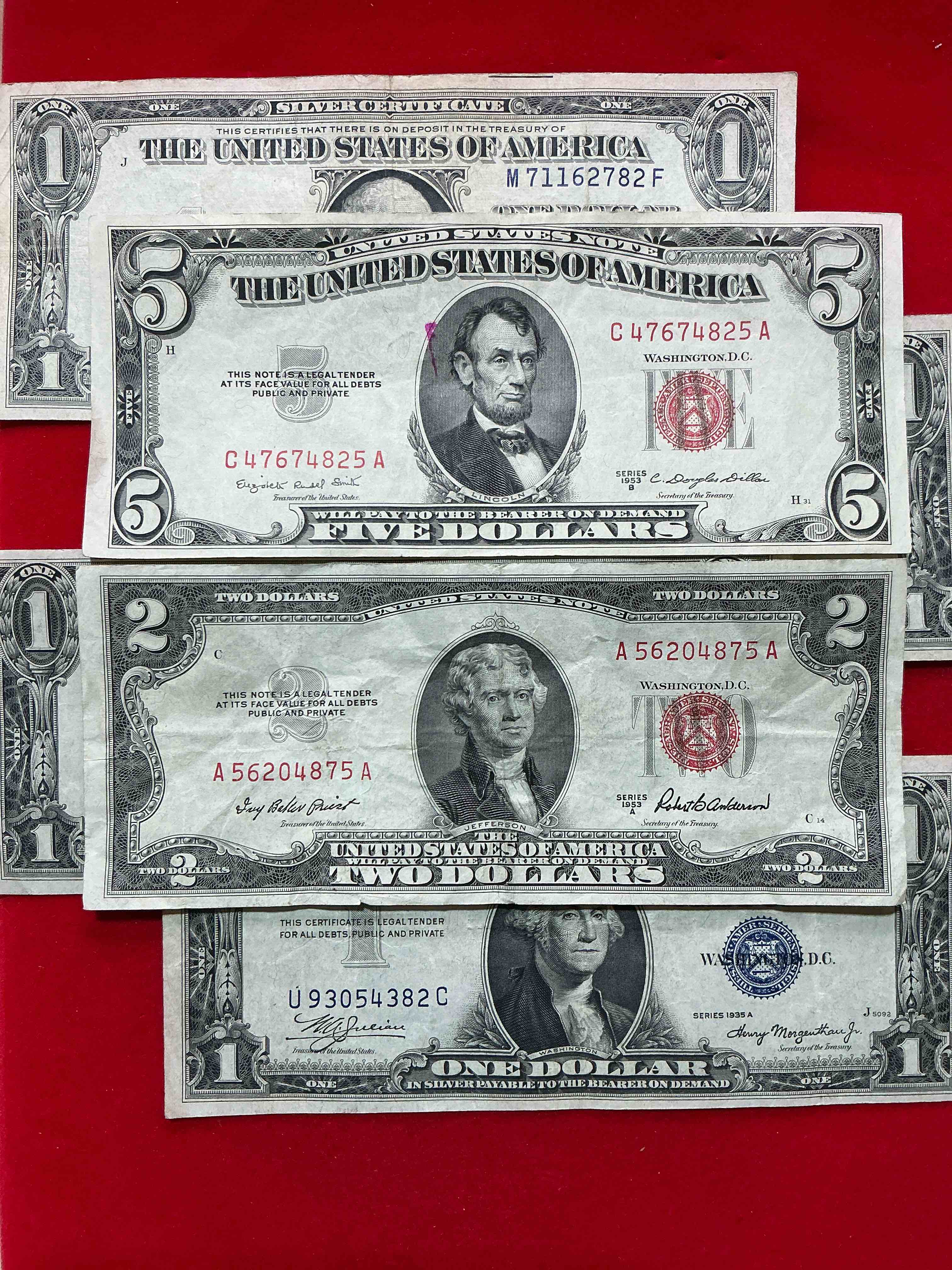 rare american dollar bills! red seal five dollar bill & red seal two dollar bill, along with silver certificates! five dollar bill ultra rare & in good condition, red seal two dollar bill in good condition & silver certificates produced from 1878 to 1964 & are still considered legal tender at face value. here are gorgeous, circulated 1935 & 1957 u.s. one dollar silver certificate, with highly collectible "blue seal!* own an awesome piece of history! american dollar lot! 