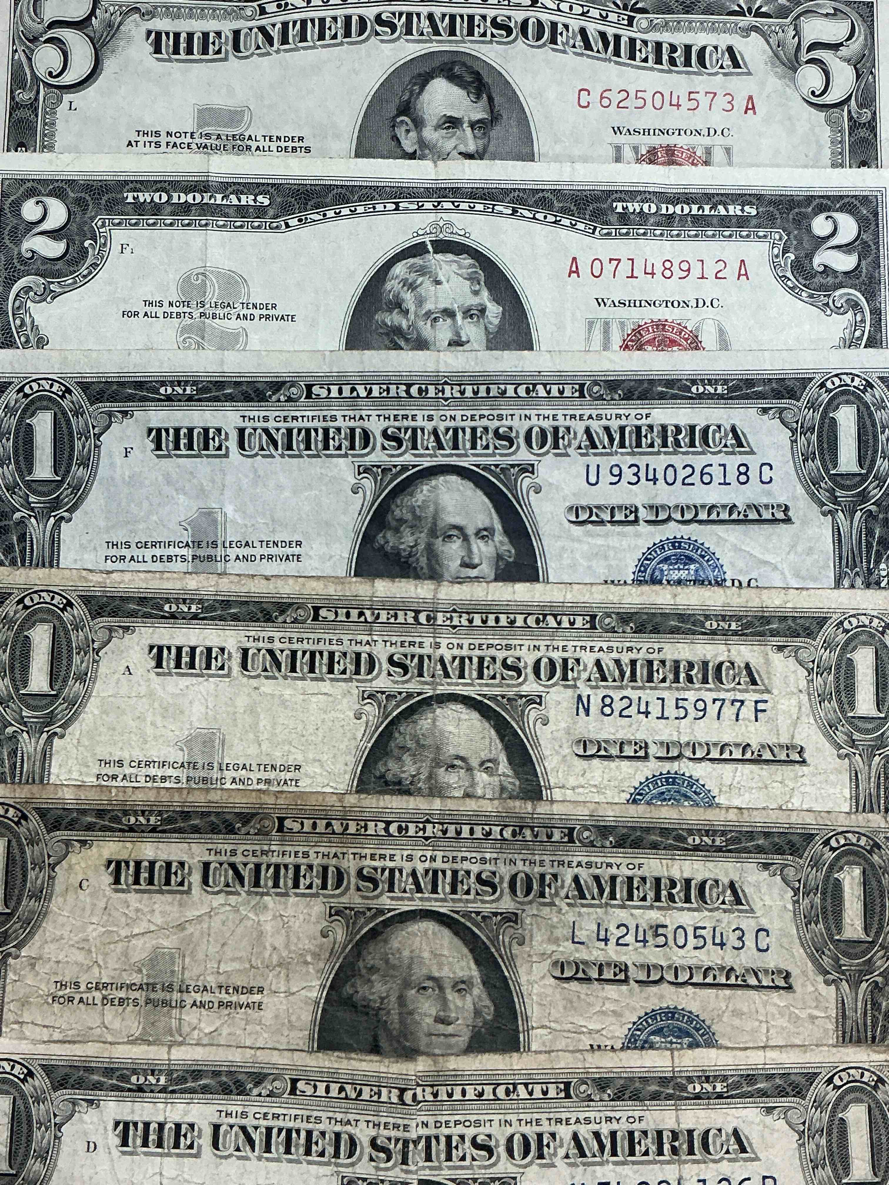 rare american dollar bills! red seal five dollar bill & red seal two dollar bill, along with silver certificates! five dollar bill ultra rare & in good condition, red seal two dollar bill in good condition & silver certificates produced from 1878 to 1964 & are still considered legal tender at face value. here are gorgeous, circulated 1935 & 1957 u.s. one dollar silver certificate, with highly collectible "blue seal!* own an awesome piece of history! american dollar lot! 