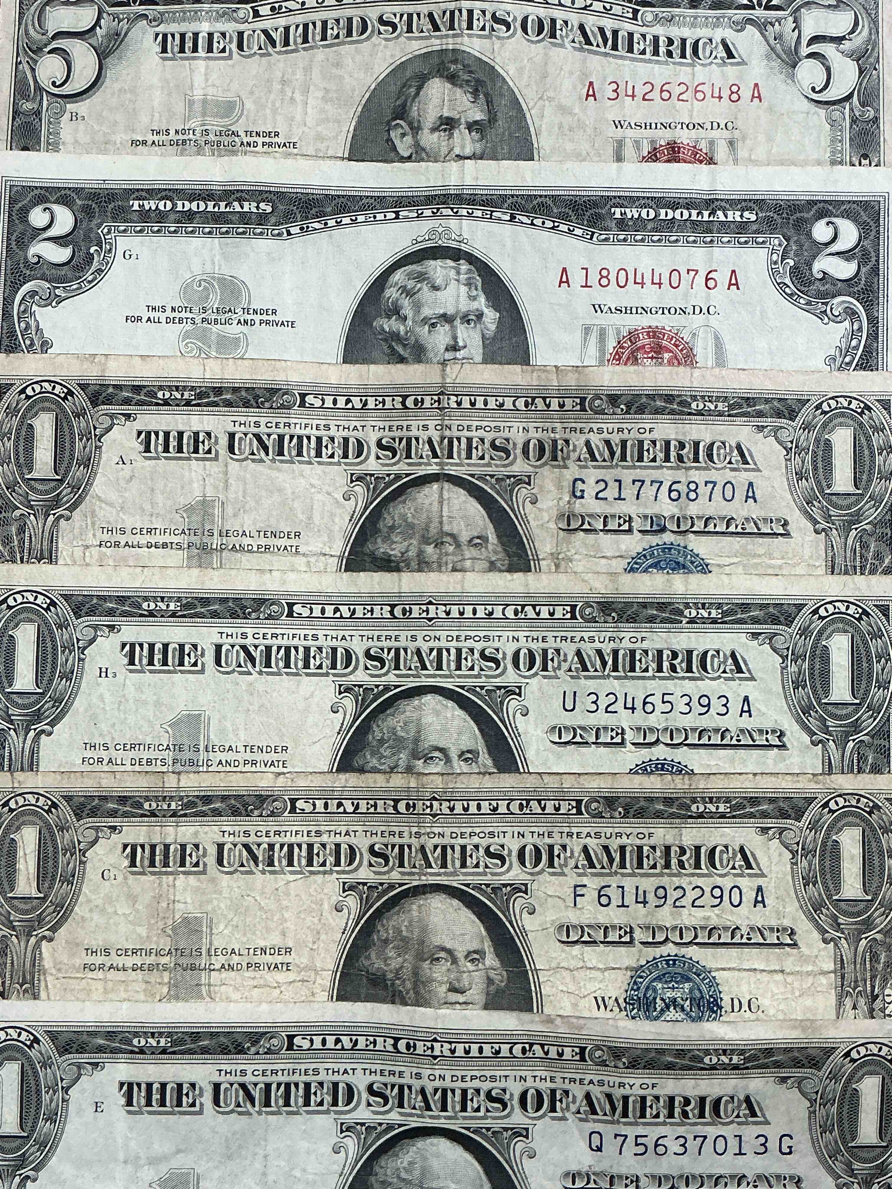 rare american dollar bills! red seal five dollar bill & red seal two dollar bill, along with silver certificates! five dollar bill ultra rare & in good condition, red seal two dollar bill in good condition & silver certificates produced from 1878 to 1964 & are still considered legal tender at face value. here are gorgeous, circulated 1935 & 1957 u.s. one dollar silver certificate, with highly collectible "blue seal!* own an awesome piece of history! american dollar lot! 