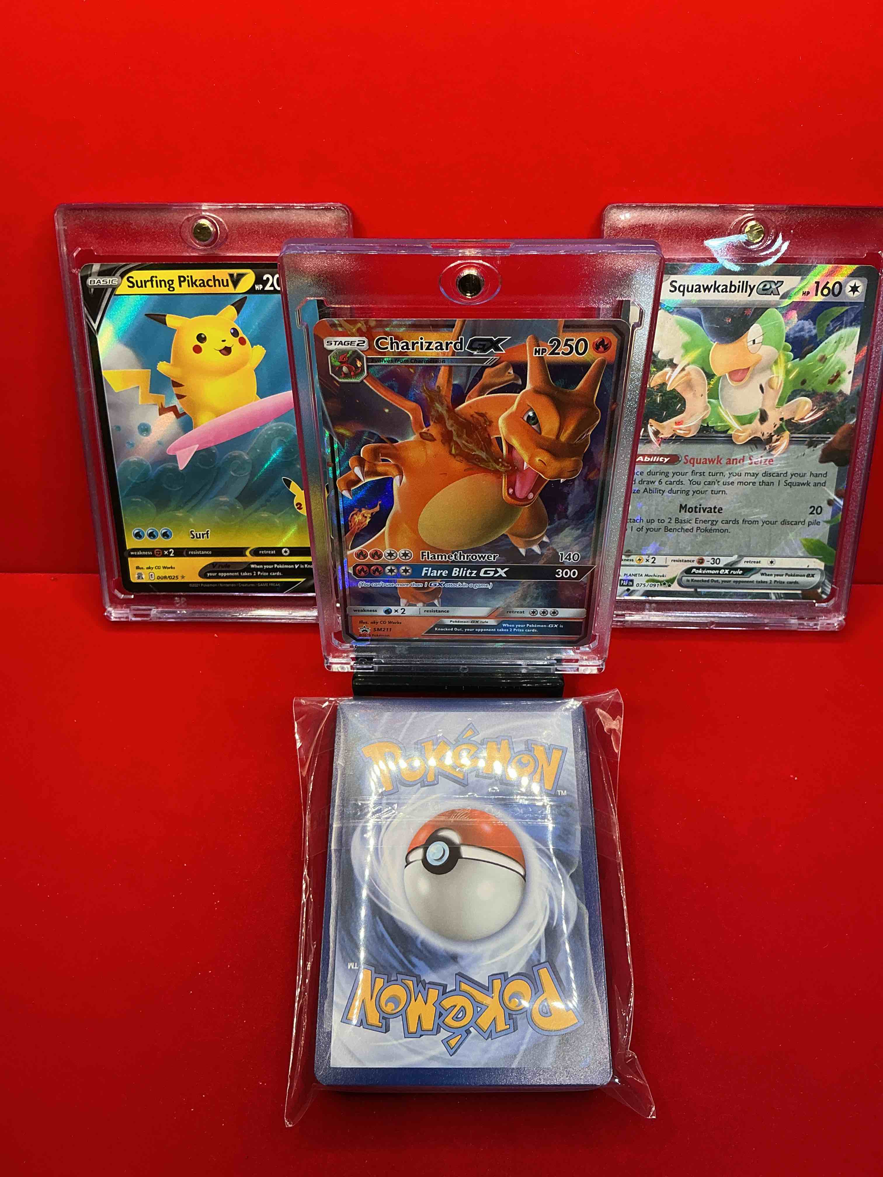 Condition photo showing New/Like New for pokémon!! charizard gx, surfing pikachu v, squawkabilly ex! along with 50 other pokémon heroes, holos, legends & commons- including holographic cards, stage 2 cards, holos in all forms & more! also includes 36 non holo common/ uncommon basic & first stage cards trainers & energy too! perfect set for collectors & enthusiasts!