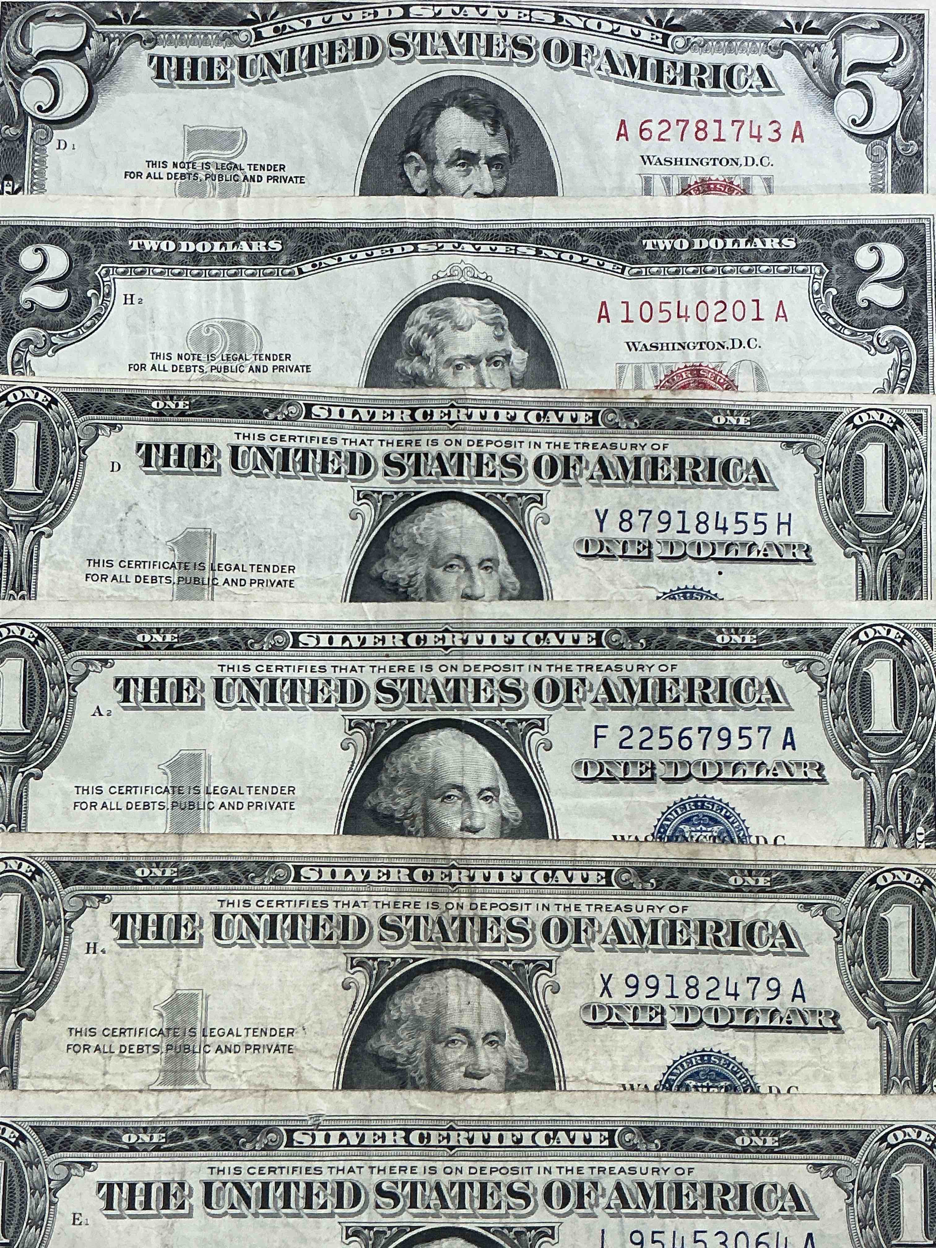 Condition photo showing Good Condition for rare american dollar bills! red seal five dollar bill & red seal two dollar bill, along with silver certificates! five dollar bill ultra rare & in good condition, red seal two dollar bill in good condition & silver certificates produced from 1878 to 1964 & are still considered legal tender at face value. here are gorgeous, circulated 1935 & 1957 u.s. one dollar silver certificate, with highly collectible "blue seal!* own an awesome piece of history! american dollar lot!