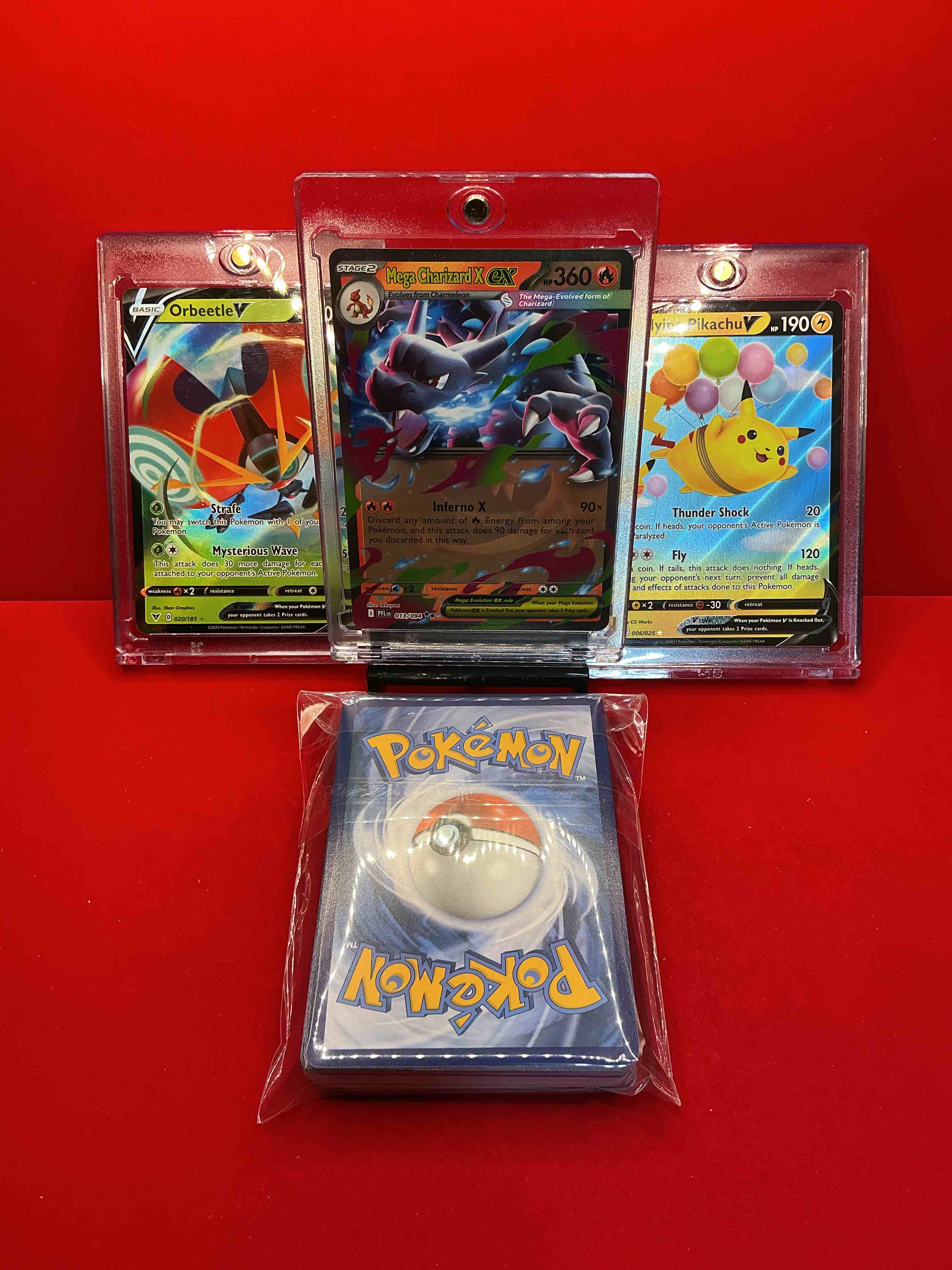Condition photo showing New/Like New for charizard x ex! flying pikachu v! orbeetle v! along with 50 other pokémon heroes, holos, legends & commons- including holographic cards, stage 2 cards, holos in all forms & more! also includes 36 non holo common/ uncommon basic & first stage cards trainers & energy too! perfect set for collectors & enthusiasts!