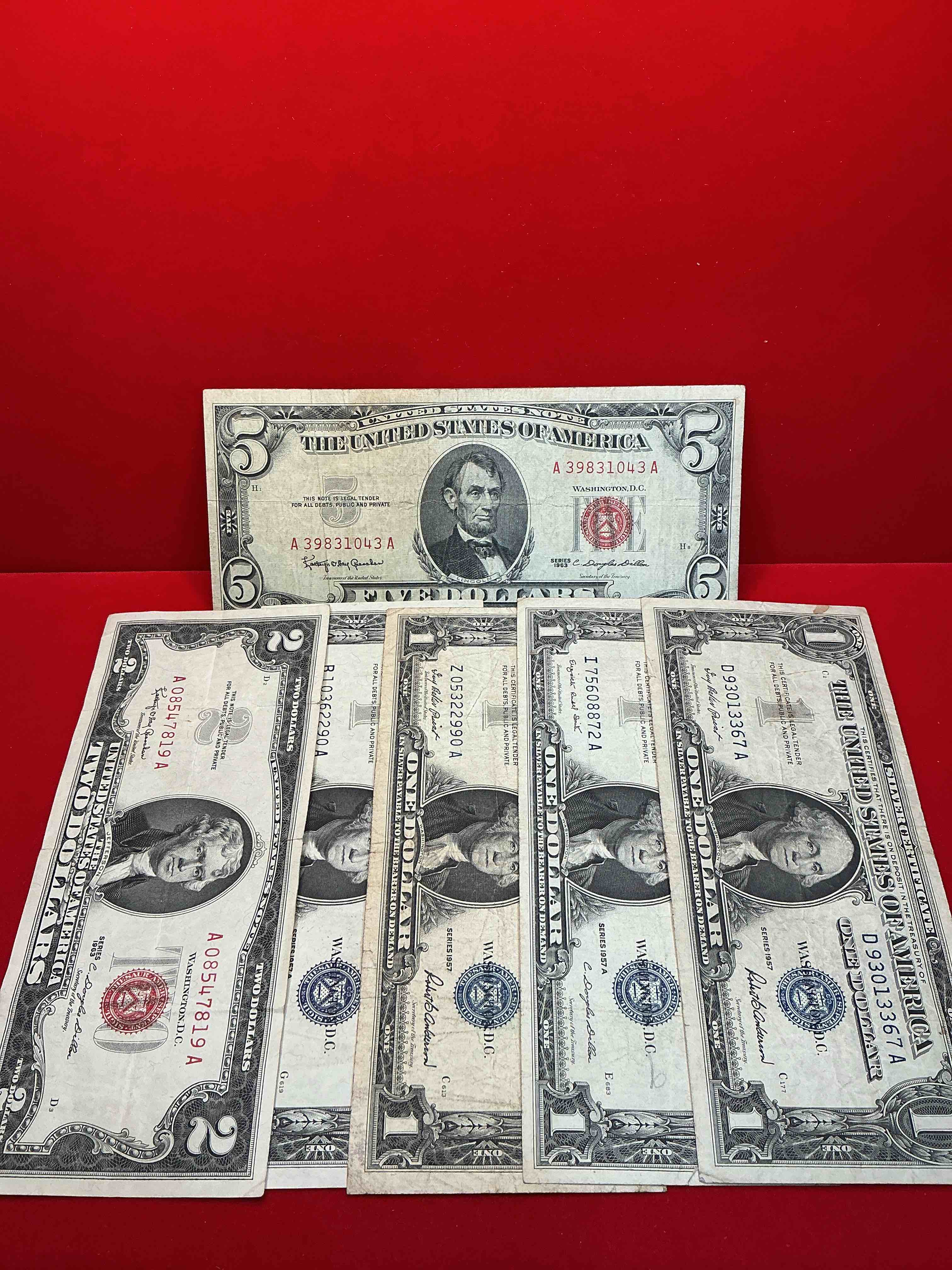 rare american dollar bills! red seal five dollar bill & red seal two dollar bill, along with silver certificates! five dollar bill ultra rare & in good condition, red seal two dollar bill in good condition & silver certificates produced from 1878 to 1964 & are still considered legal tender at face value. here are gorgeous, circulated 1935 & 1957 u.s. one dollar silver certificate, with highly collectible "blue seal!* own an awesome piece of history! american dollar lot! 
