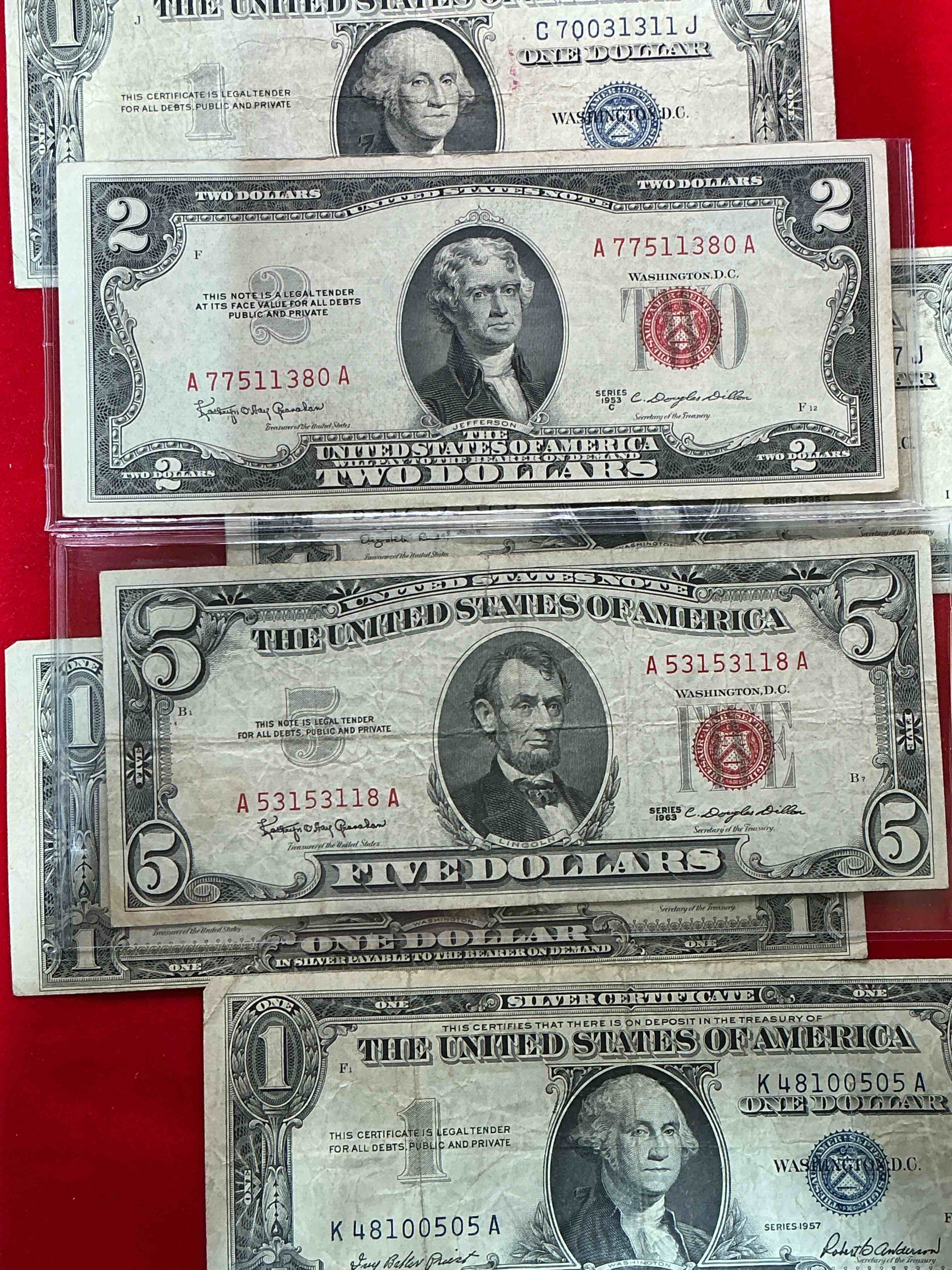 rare american dollar bills! red seal five dollar bill & red seal two dollar bill, along with silver certificates! five dollar bill ultra rare & in good condition, red seal two dollar bill in good condition & silver certificates produced from 1878 to 1964 & are still considered legal tender at face value. here are gorgeous, circulated 1935 & 1957 u.s. one dollar silver certificate, with highly collectible "blue seal!* own an awesome piece of history! american dollar lot! 