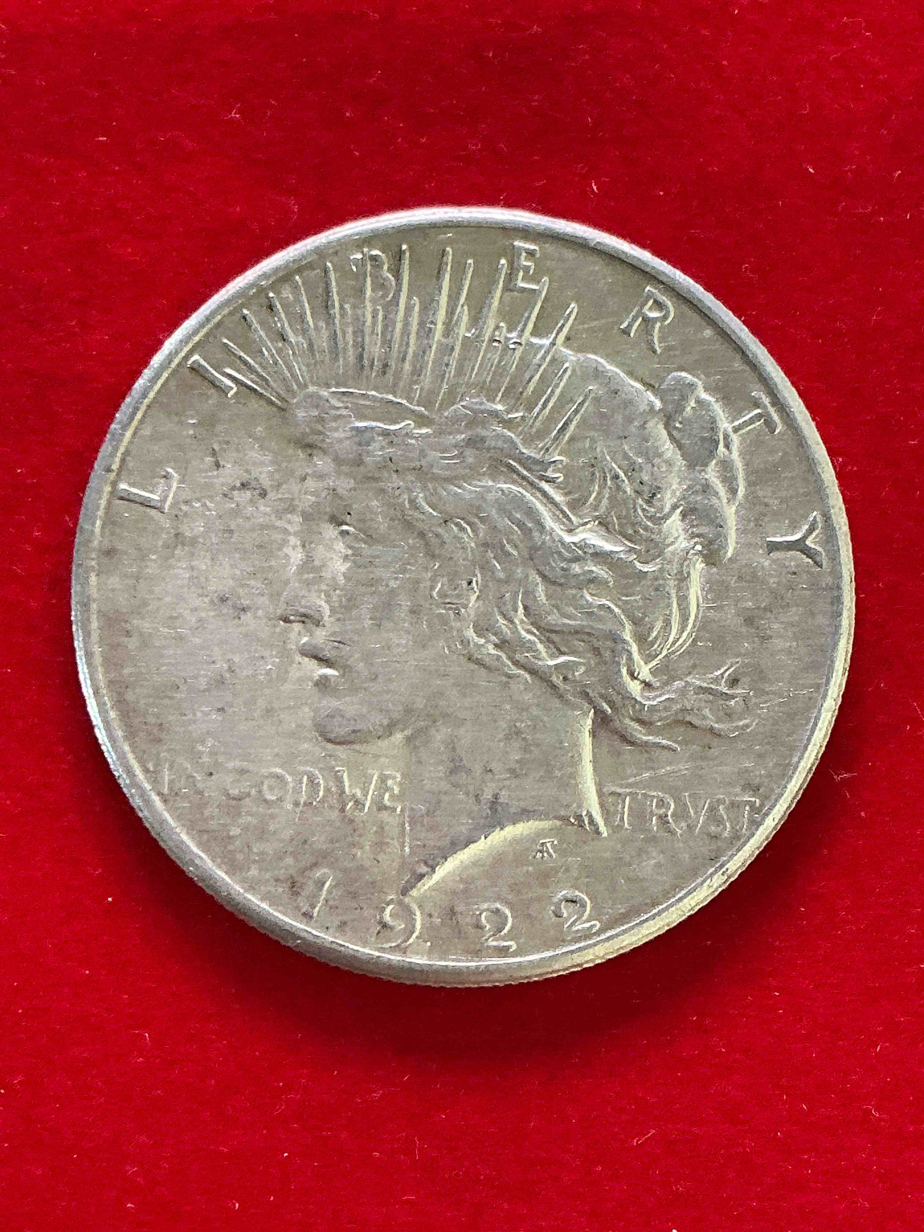 silver peace dollar! one dollar coin from 1922! these one ounce coins are 90% silver & super rare! liberty peace dollars are highly coveted by collectors for their value & beautiful design. add a one ounce liberty peace dollar at 90% silver to your collection! super rare! (dime in picture used for size reference only, not included)