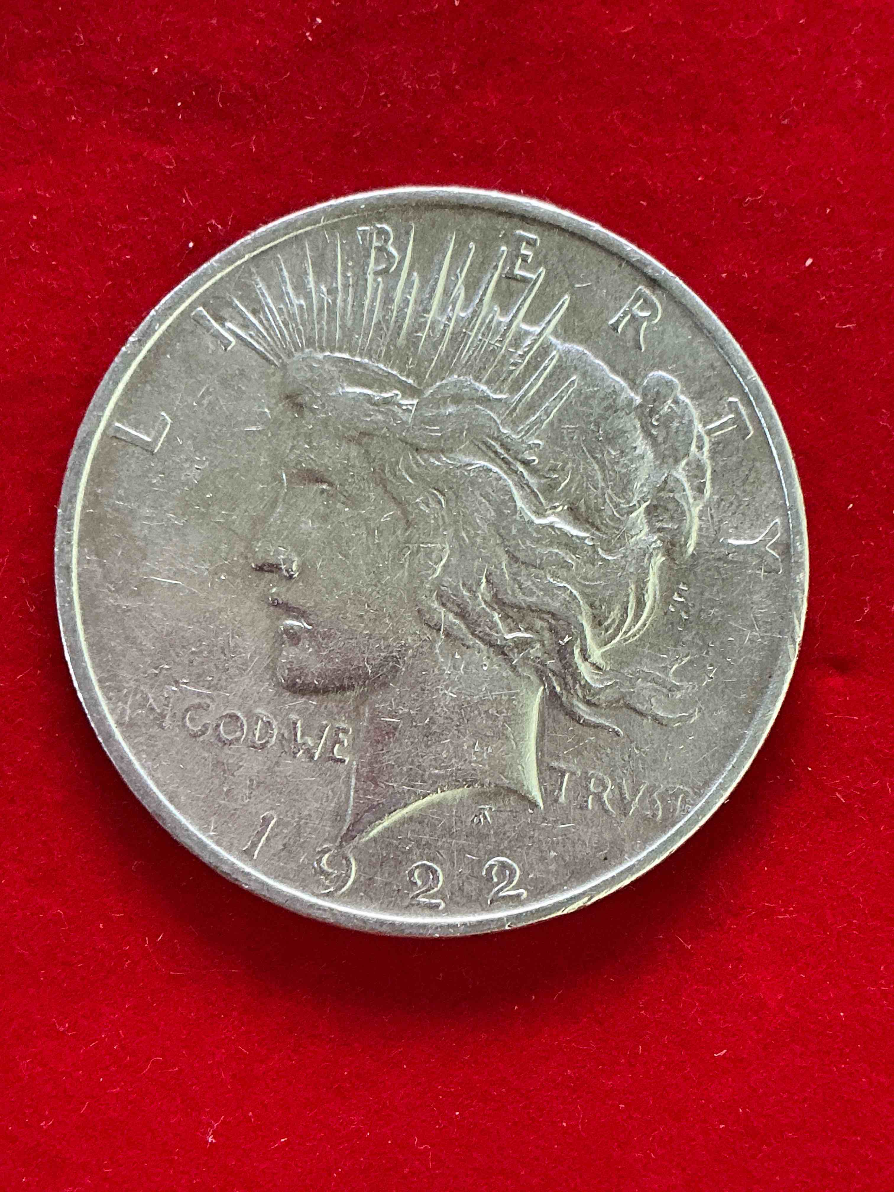 silver peace dollar! one dollar coin from 1922! these one ounce coins are 90% silver & super rare! liberty peace dollars are highly coveted by collectors for their value & beautiful design. add a one ounce liberty peace dollar at 90% silver to your collection! super rare! (dime in picture used for size reference only, not included)