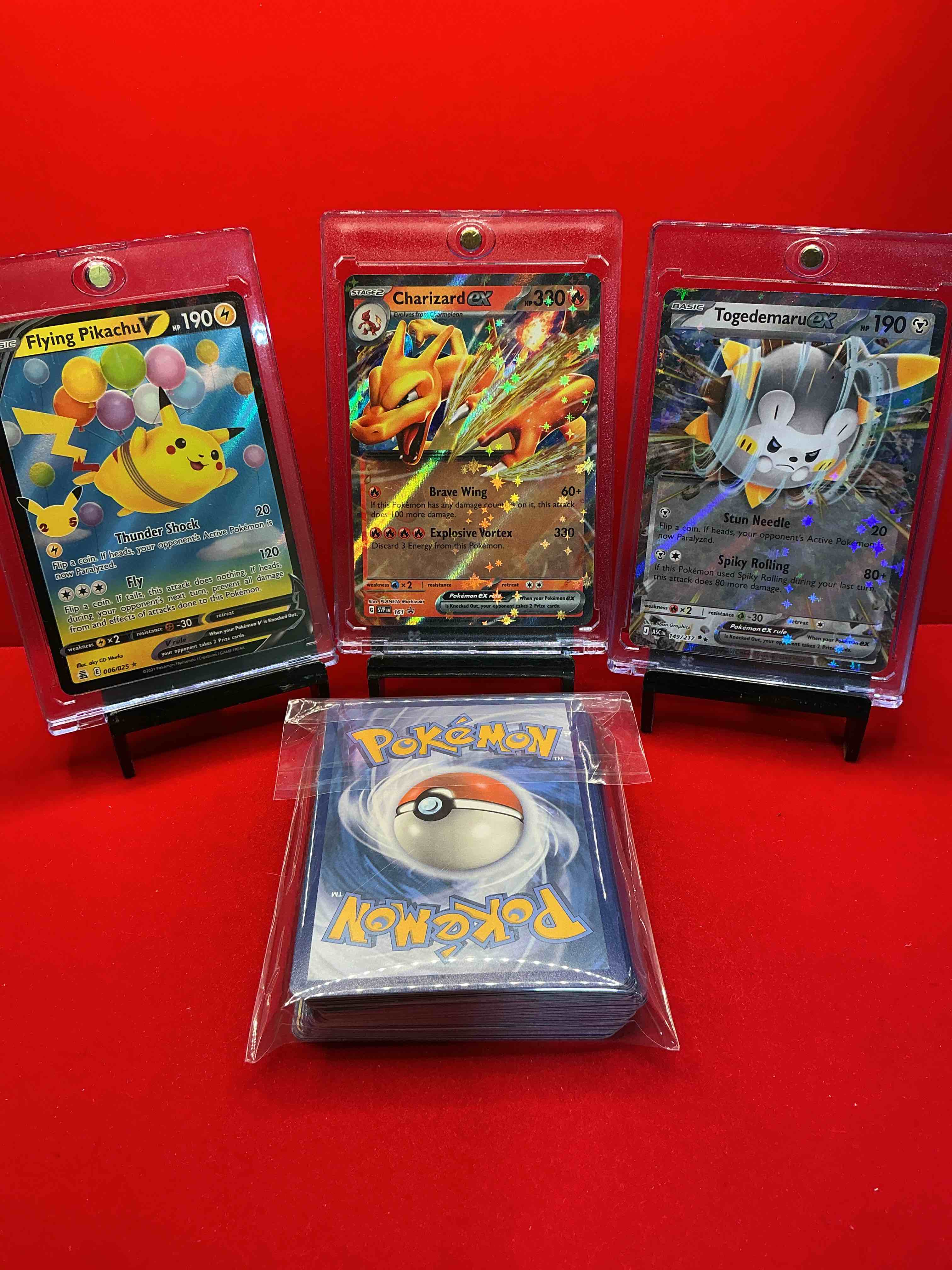 Condition photo showing New/Like New for pokémon party! charizard ex! flying pikachu v! togedemaru ex! along with 50 other pokémon heroes, holos, legends & commons- including holographic cards, stage 2 cards, holos in all forms & more! also includes 36 non holo common/ uncommon basic & first stage cards trainers & energy too! perfect set for collectors & enthusiasts!