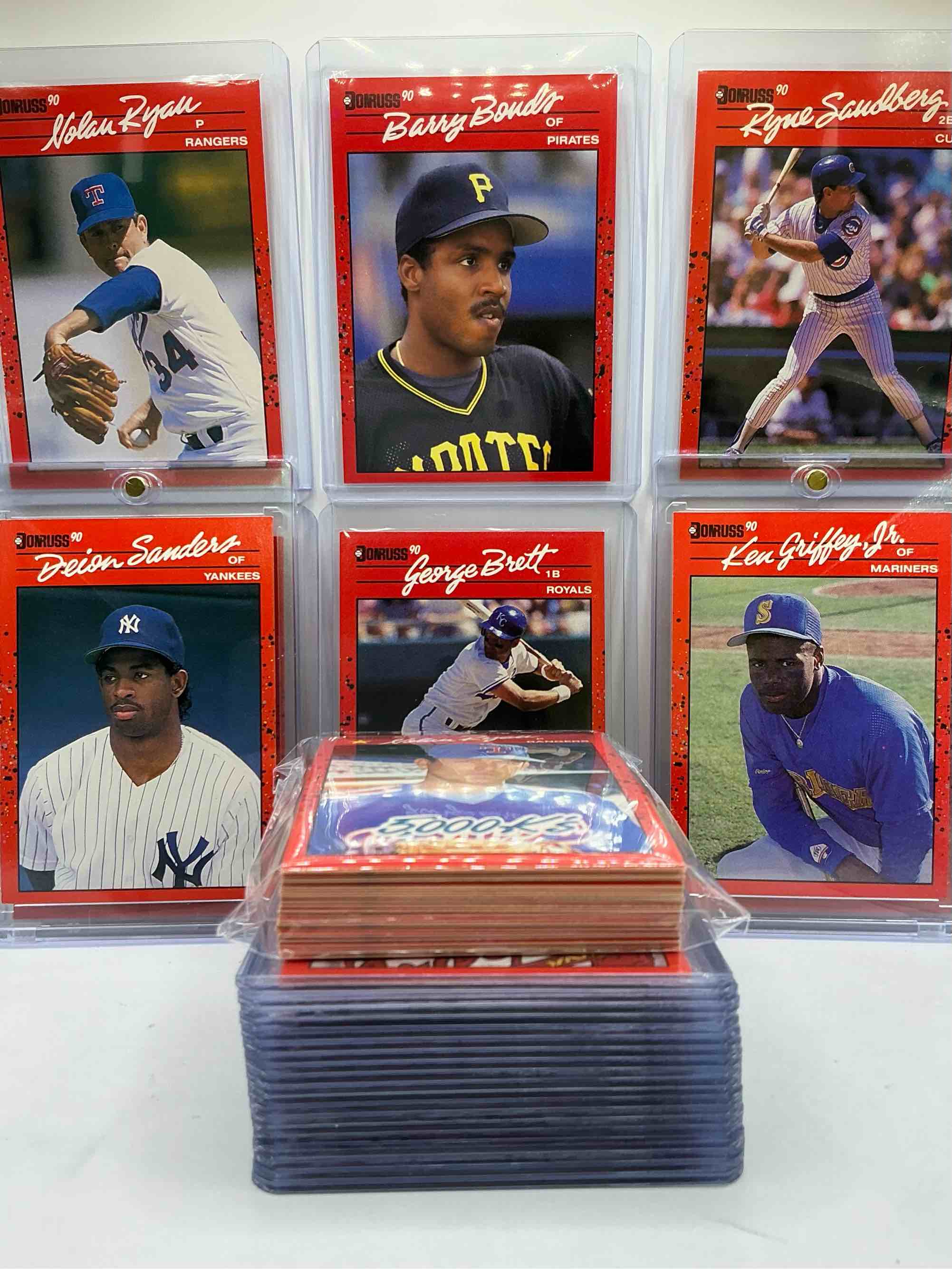1990 donruss baseball 50 card craziness! ken griffey jr, deion sanders, randy johnson, barry bonds, john smoltz, kirby puckett, tom glavine, rickey henderson, don mattingly, cal ripken, wade boggs, doc gooden, greg maddux, fernando valenzuela, nolan ryan, roger clemens, george brett, tony gwynn & more! the best players from the time! super rare set with all of these stars! 50 card craziness! legends, heroes & commons!