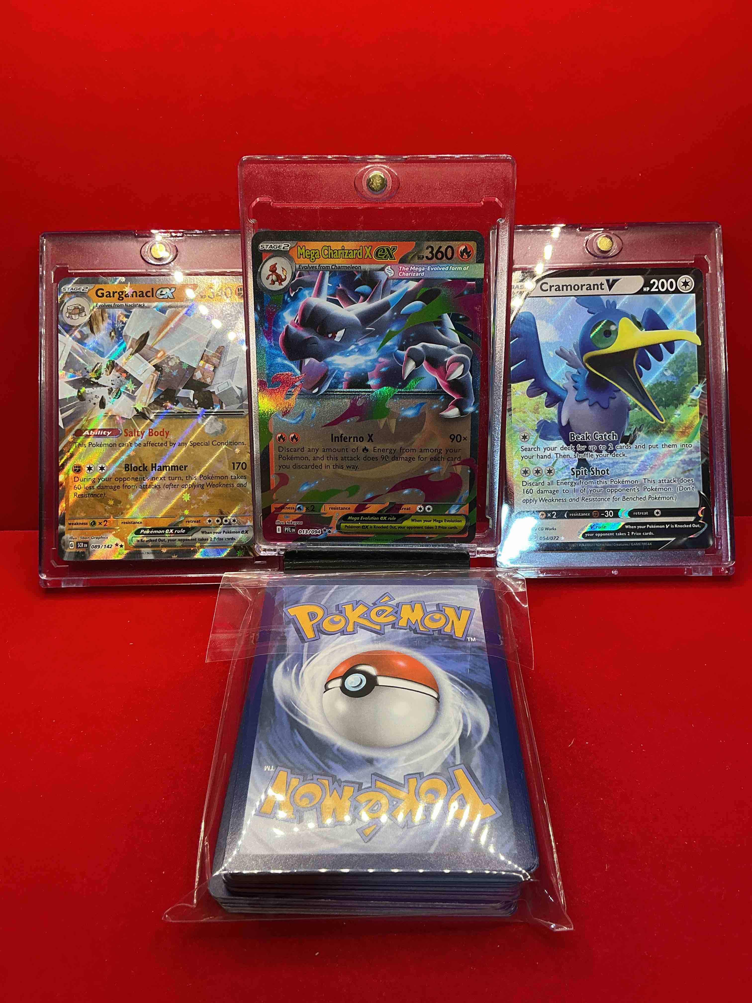 Condition photo showing New/Like New for pokémon palooza! mega charizard x ex! garganacl ex! cramorant v! along with 50 other pokémon heroes, holos, legends & commons- including holographic cards, stage 2 cards, holos in all forms & more! also includes 36 non holo common/ uncommon basic & first stage cards trainers & energy too! perfect set for collectors & enthusiasts!