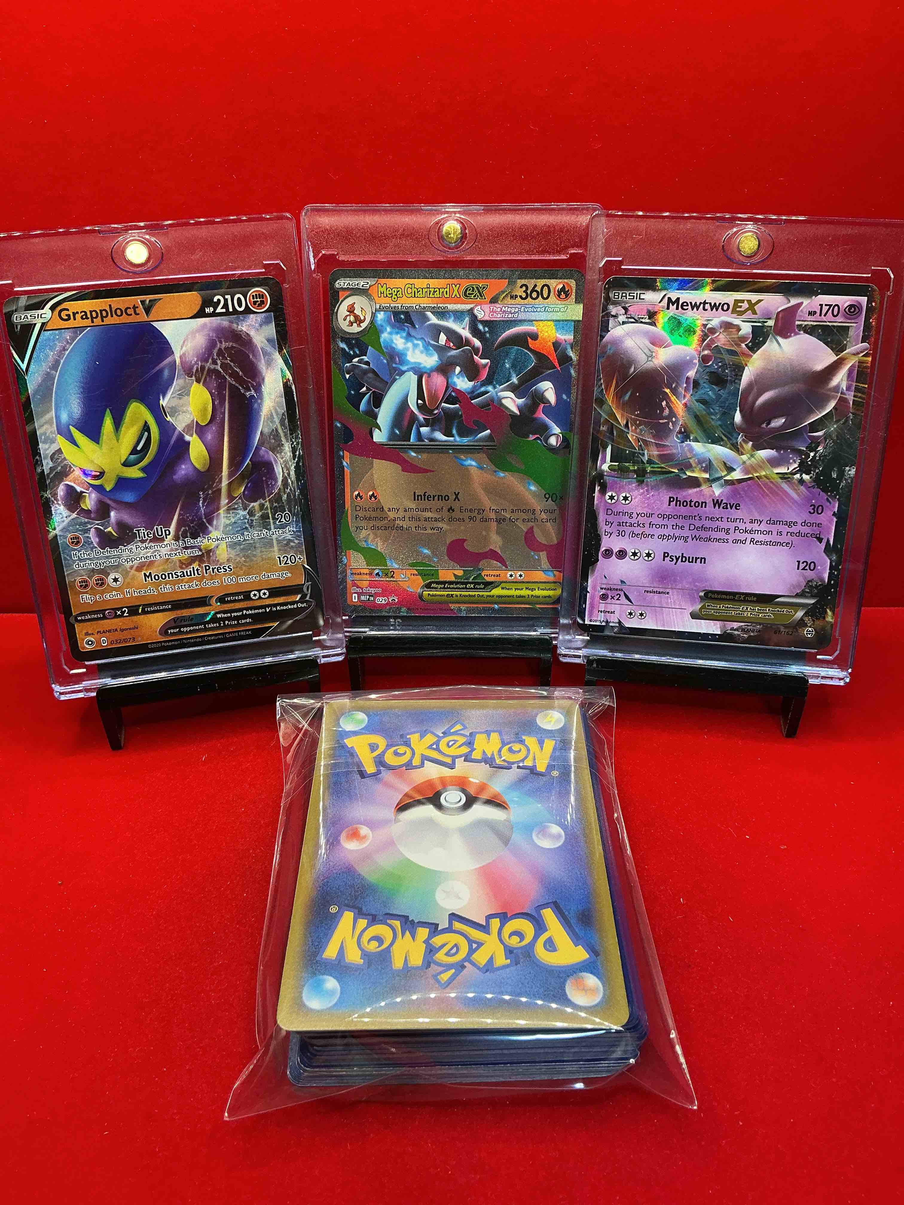 Condition photo showing New/Like New for pokémon! charizard x ex! mewtwo ex! grapploct v! along with 50 other pokémon heroes, holos, legends & commons- including holographic cards, stage 2 cards, holos in all forms & more! also includes 36 non holo common/ uncommon basic & first stage cards trainers & energy too! perfect set for collectors & enthusiasts!