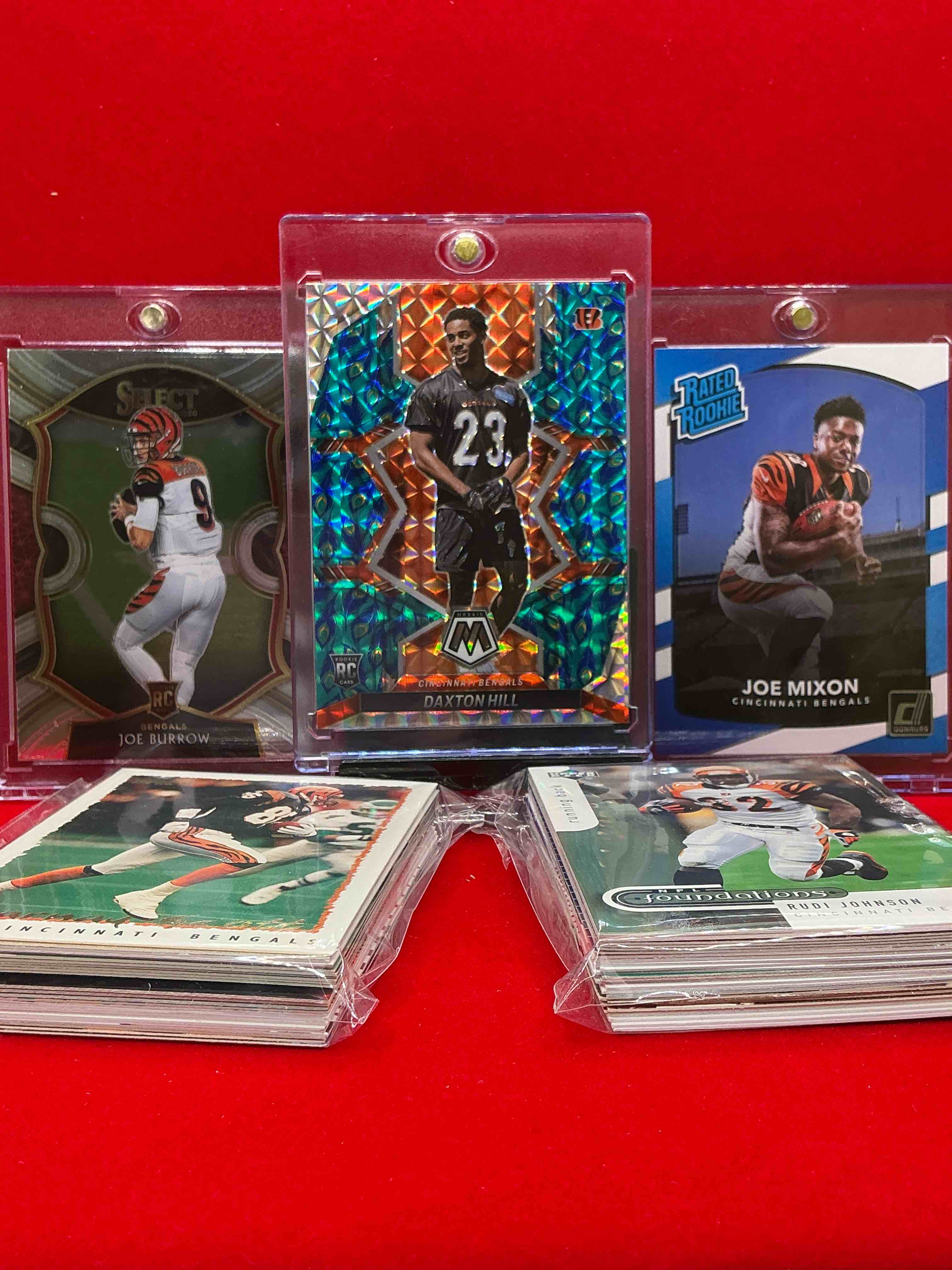 Condition photo showing New/Like New for ultra rare peacock design mosaic dax hill rookie! joe mixon & joe burrow rookies as well! wow! bengals 50 card lot, includes commons, rookies, legends & more! vintage & new! collect your favorite players!