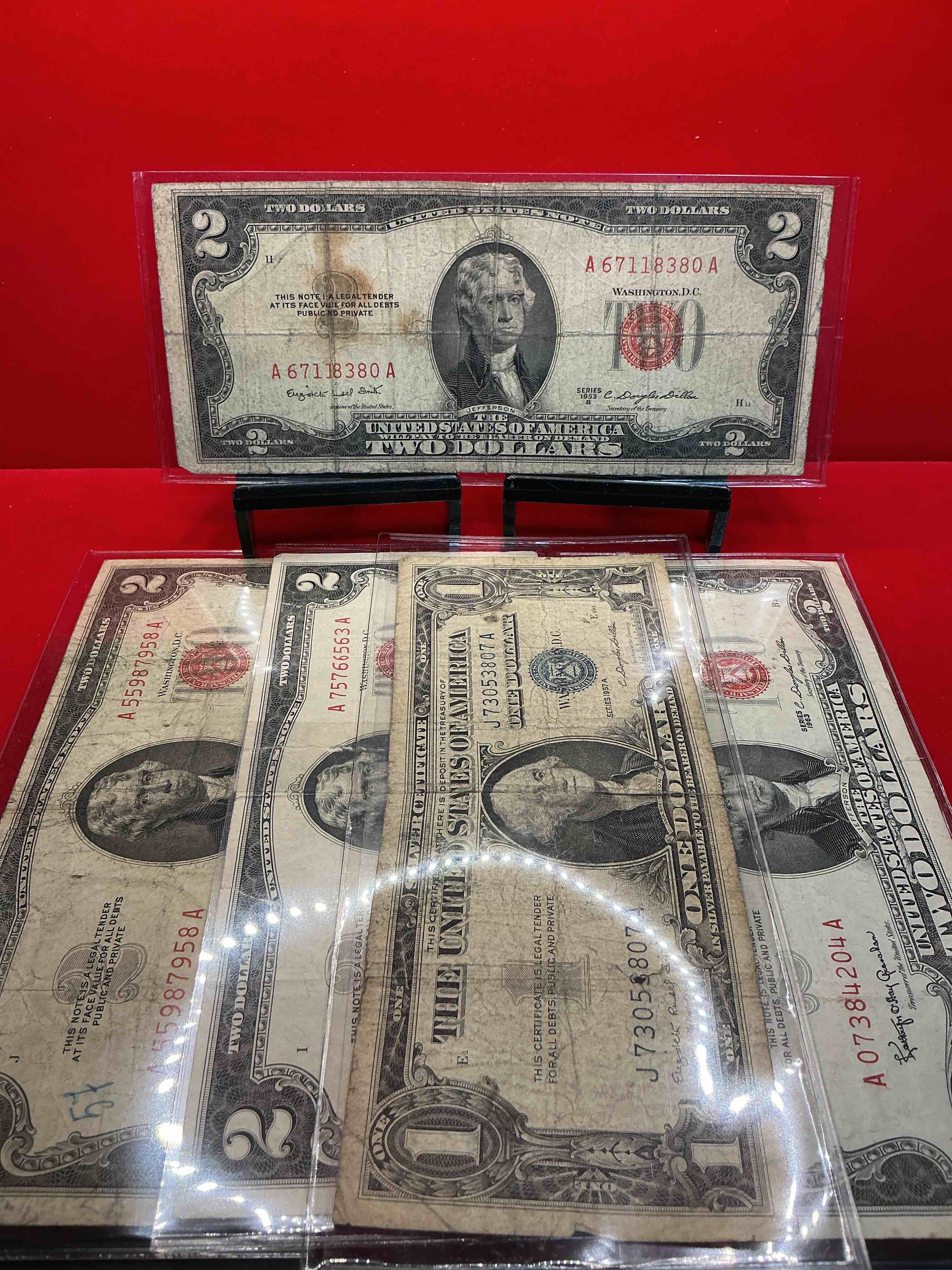 rare red seal two dollar bills! 1953 & 1963 edition paper money! check out these rare bills, perfect addition to any collection! also includes blue seal 1957 one dollar bill!