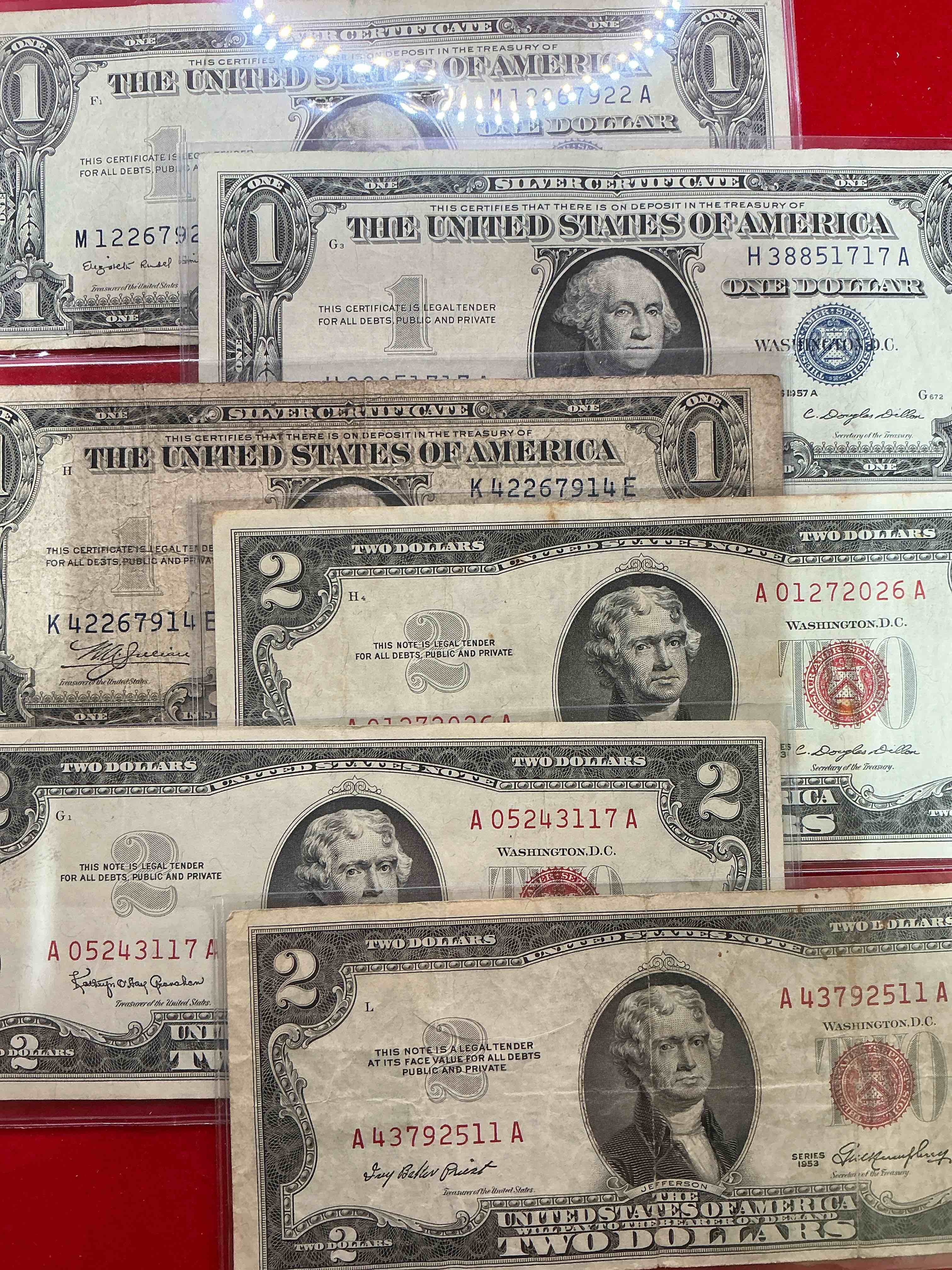 rare red seal two dollar bills! 1953 & 1963 edition paper money! check out these rare bills, perfect addition to any collection! along with one dollar blue seals!