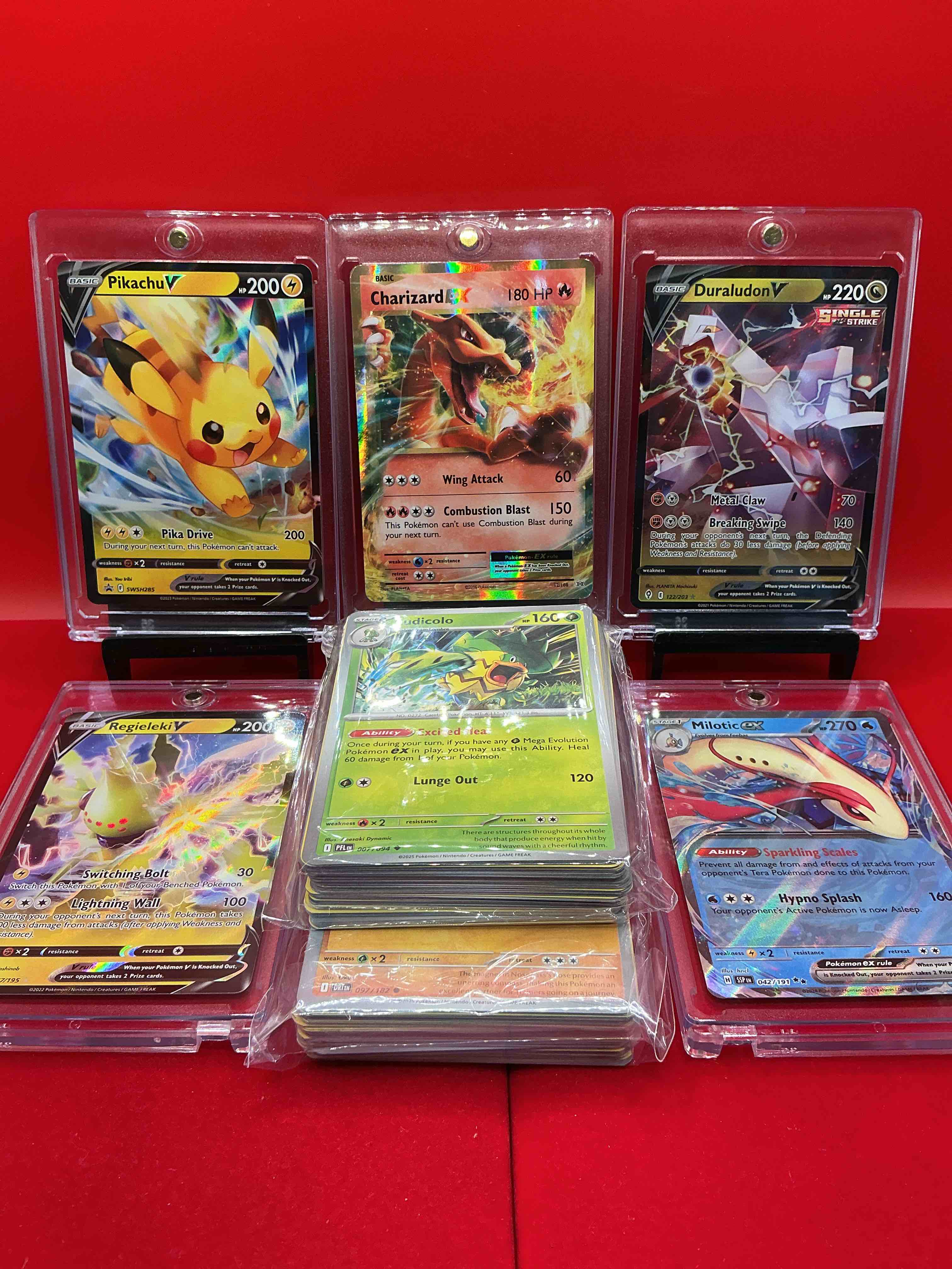 Pokémon Galore!  CHARIZARD, PIKACHU, DURALUDON! 100 Count Lot! & So Much More, Along With 100 Other Pokémon Heroes, Holos, Legends & Commons- Including Holographic Cards, Cool Holos & More! 100 Count Lot Includes Non Holo Common/ Uncommon Basic & First Stage Cards & Could Even Include Trainers & Energy Too! Perfect Set For Collectors, Enthusiasts, Investors & Re-Sellers!