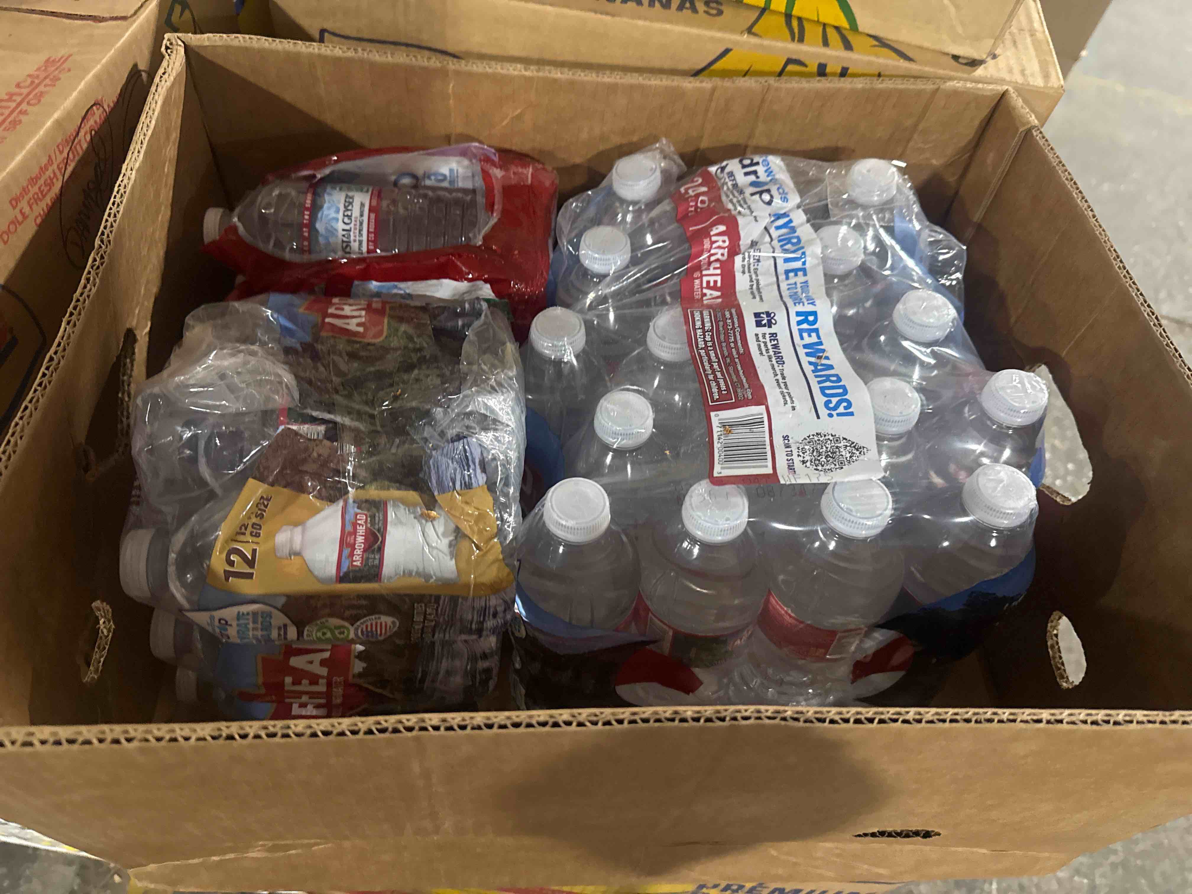 Condition photo showing Brand New for box of water 