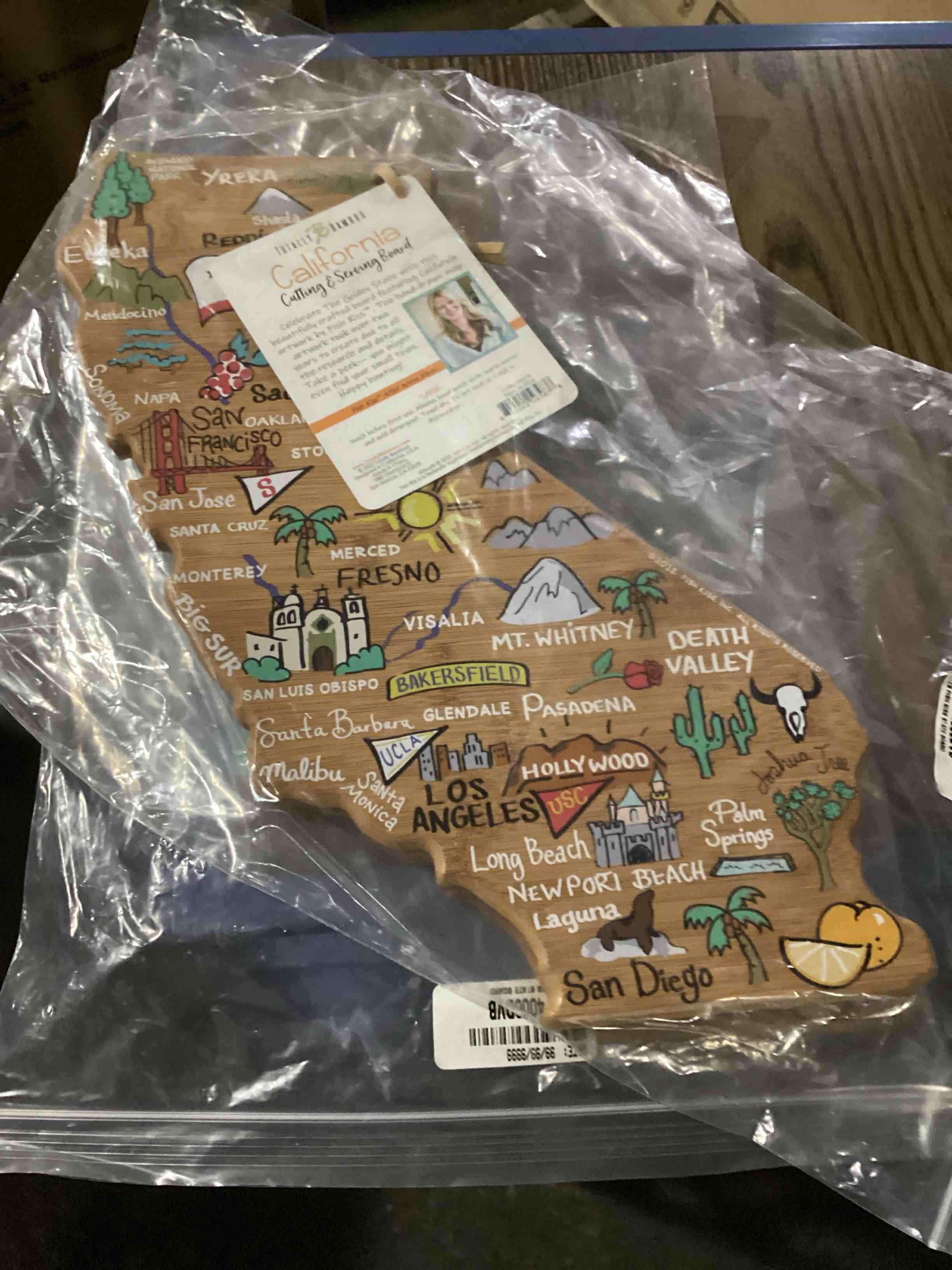 Condition photo showing New/Like New for totally bamboo california fish kiss cutting board: lightweight bamboo, multicolored, 11"x14.25", hand wash, 1-year warranty