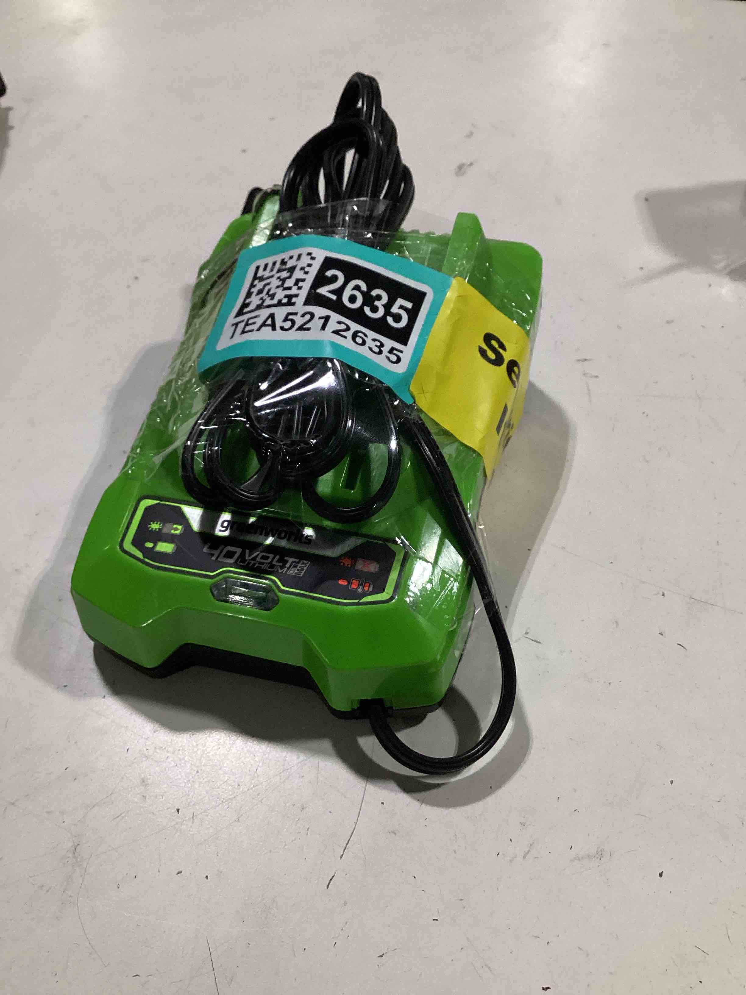 Condition photo showing As Is for untested. greenworks 40v battery charger (genuine greenworks charger)