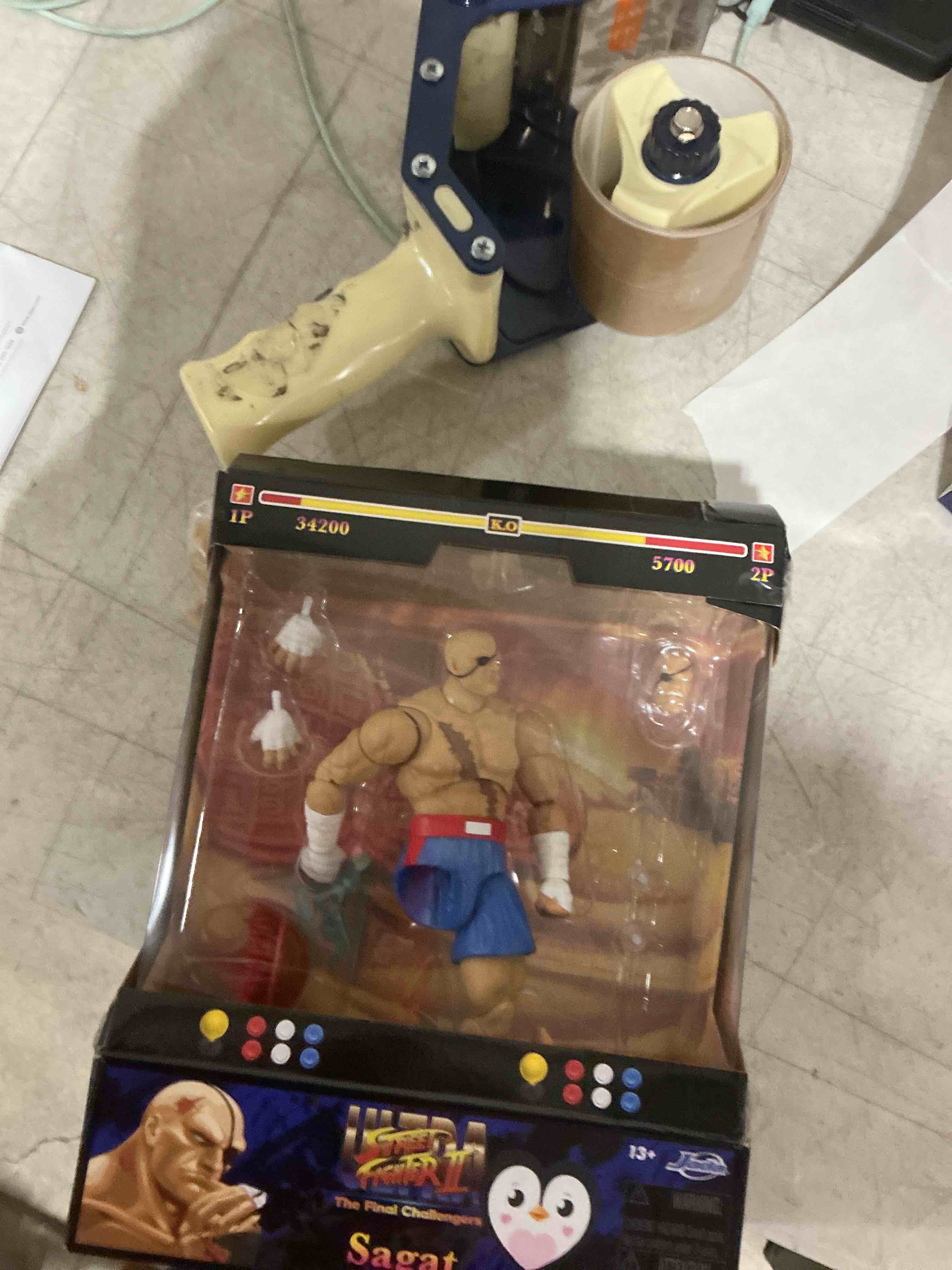 Condition photo showing As Is for as is. leg detached. sagar. street fighter acton doll