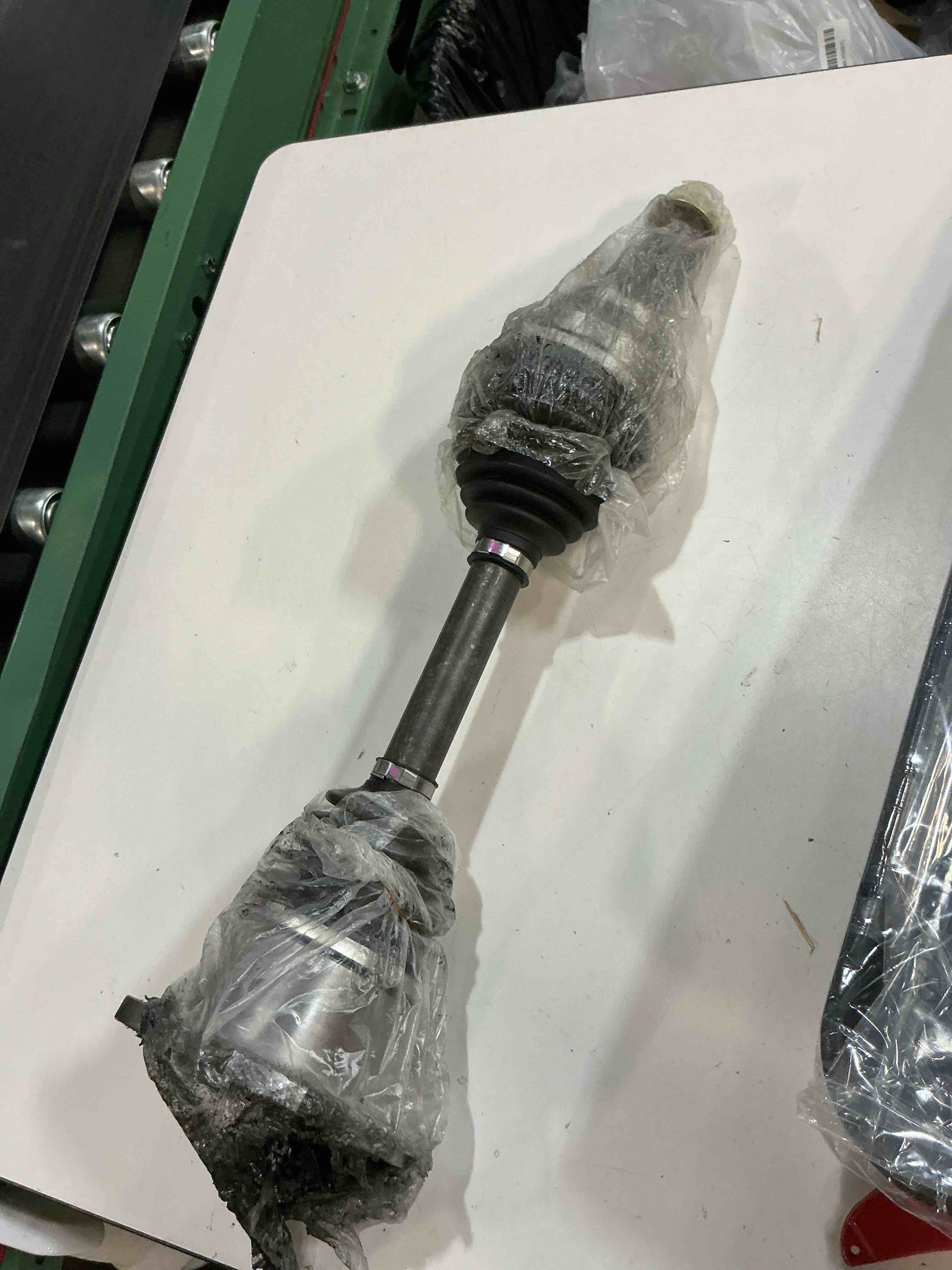 Condition photo showing As Is for cardone 66-1430 cv drive axle drive shaft automotive replacement compatible with cadillac, chevrolet, gmc models