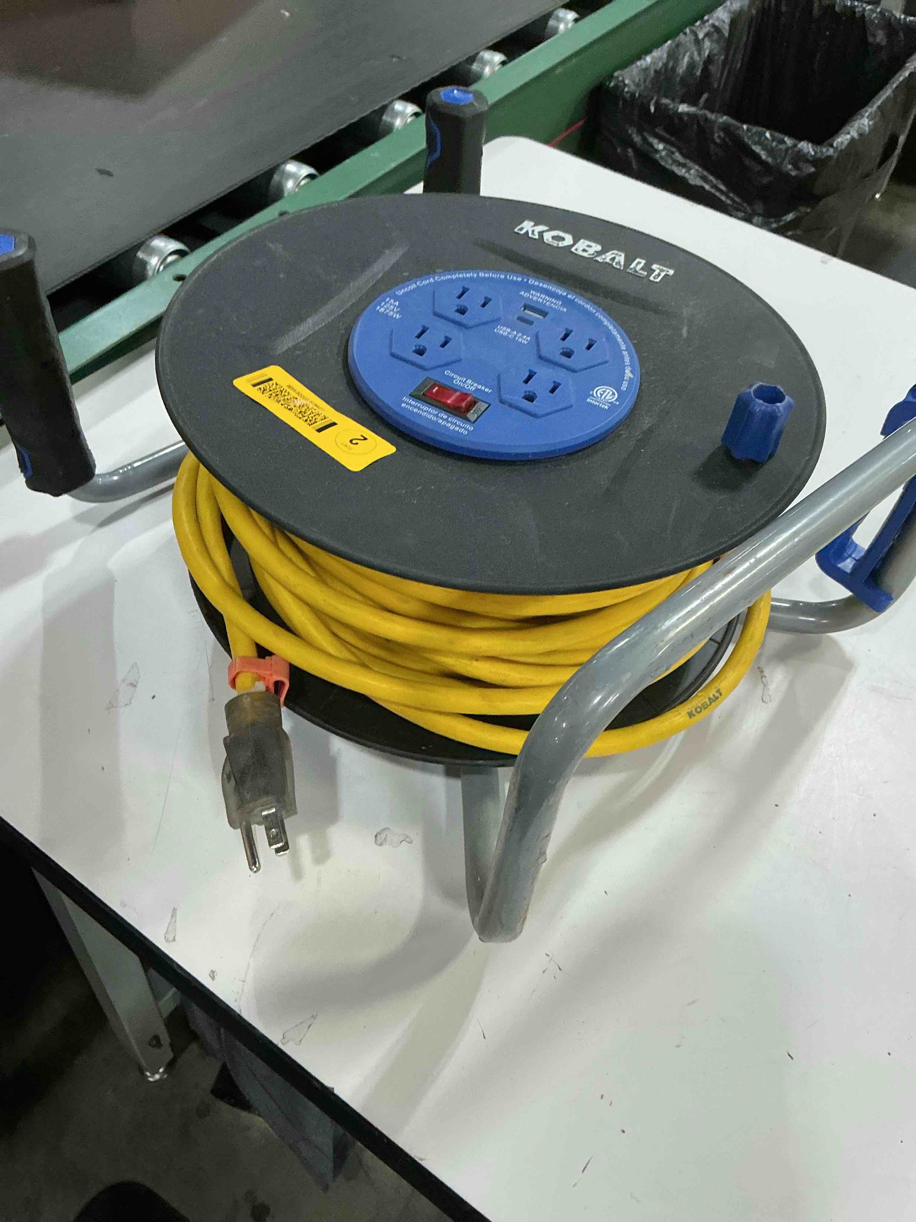Condition photo showing As Is for kobalt 4-outlet portable thermoplastic power station cord reel with 75ft 12/3 yellow sjtw cord