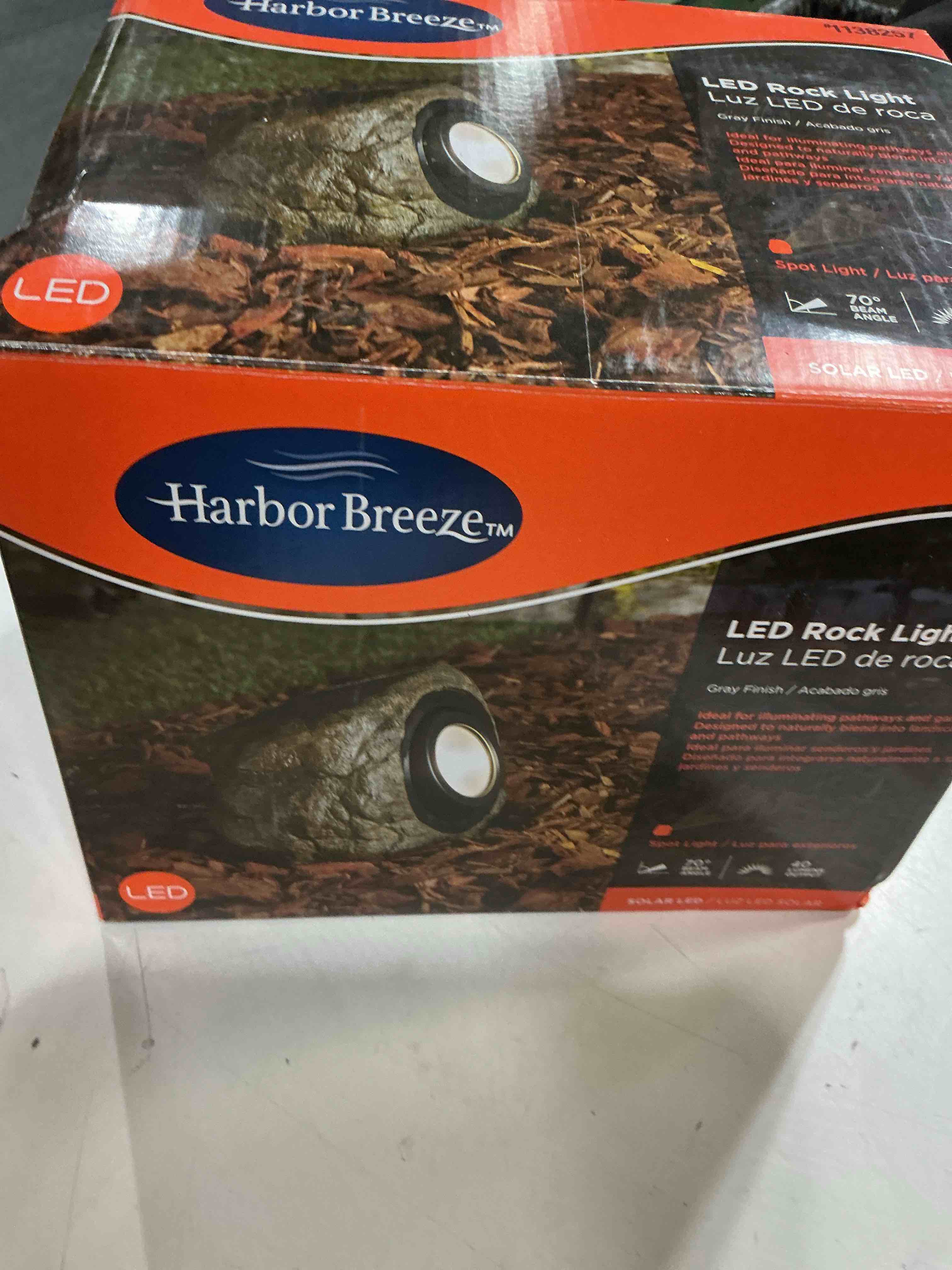 Condition photo showing As Is for harbor breeze rock flood light 40 -lumens 3.2 -watt grey warm white solar led flood light