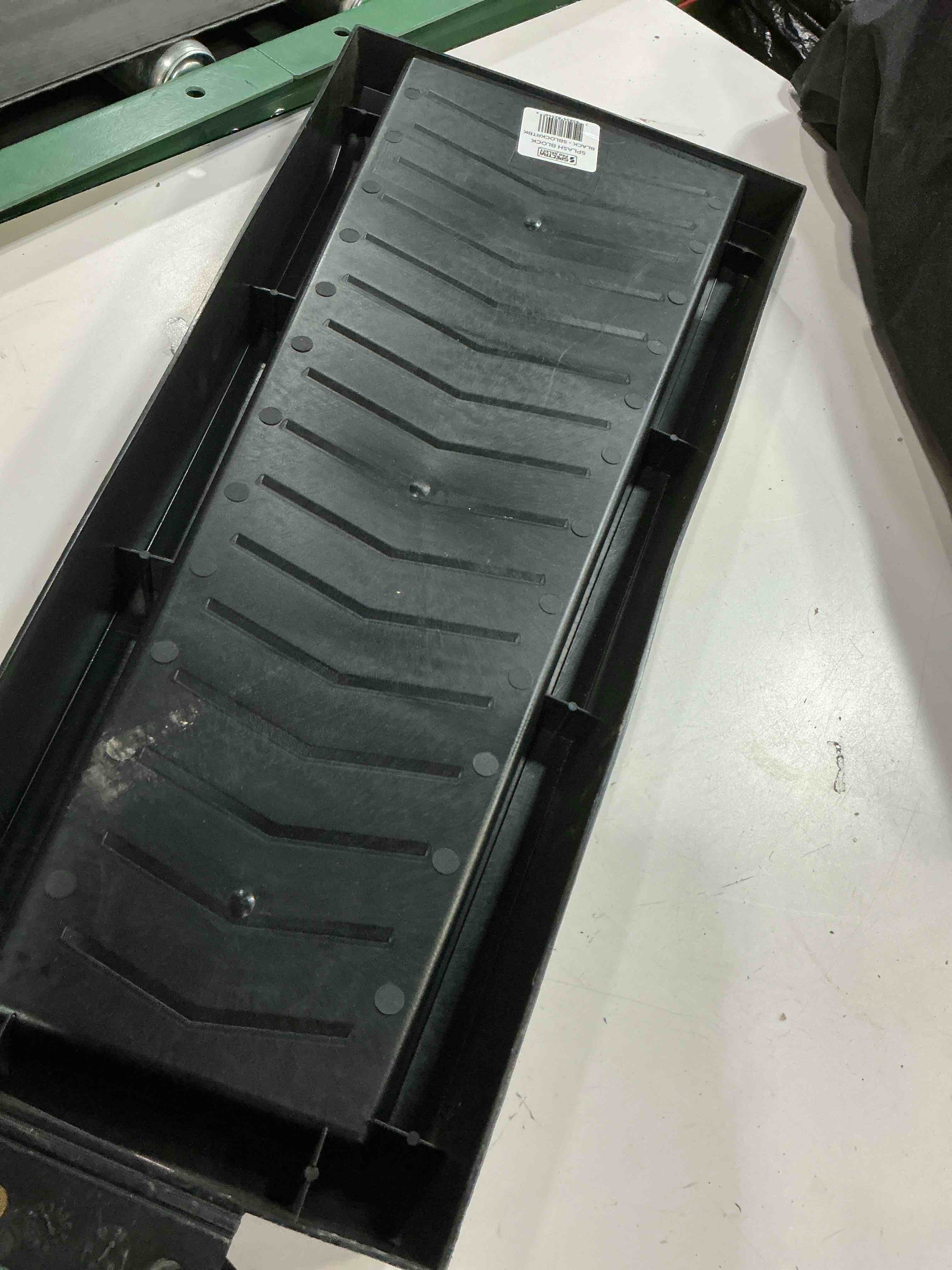 Condition photo showing As Is for 24 in. black vinyl splash block