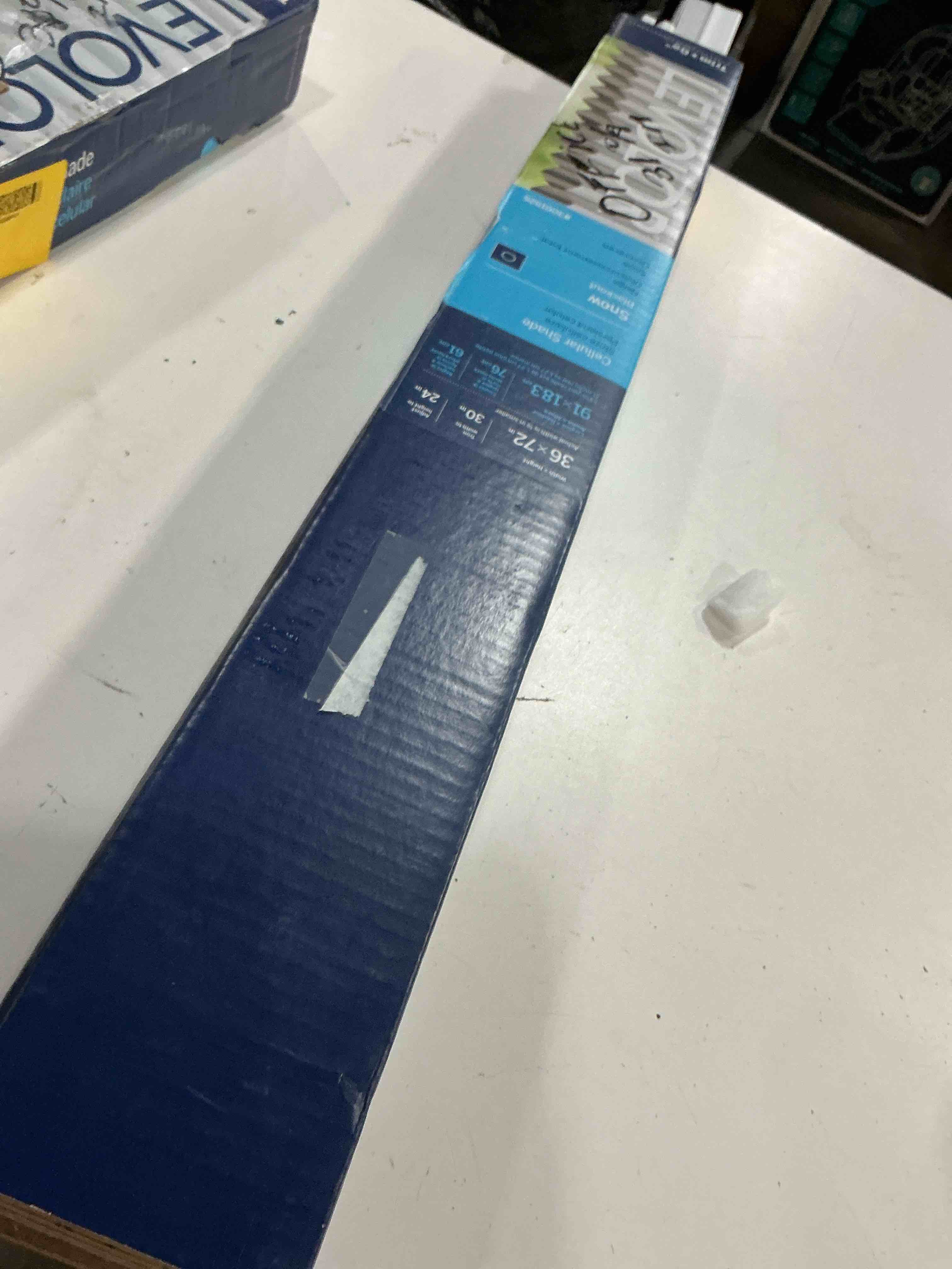 Condition photo showing As Is for levolor 36-in x 72-in snow blackout cordless cellular shade