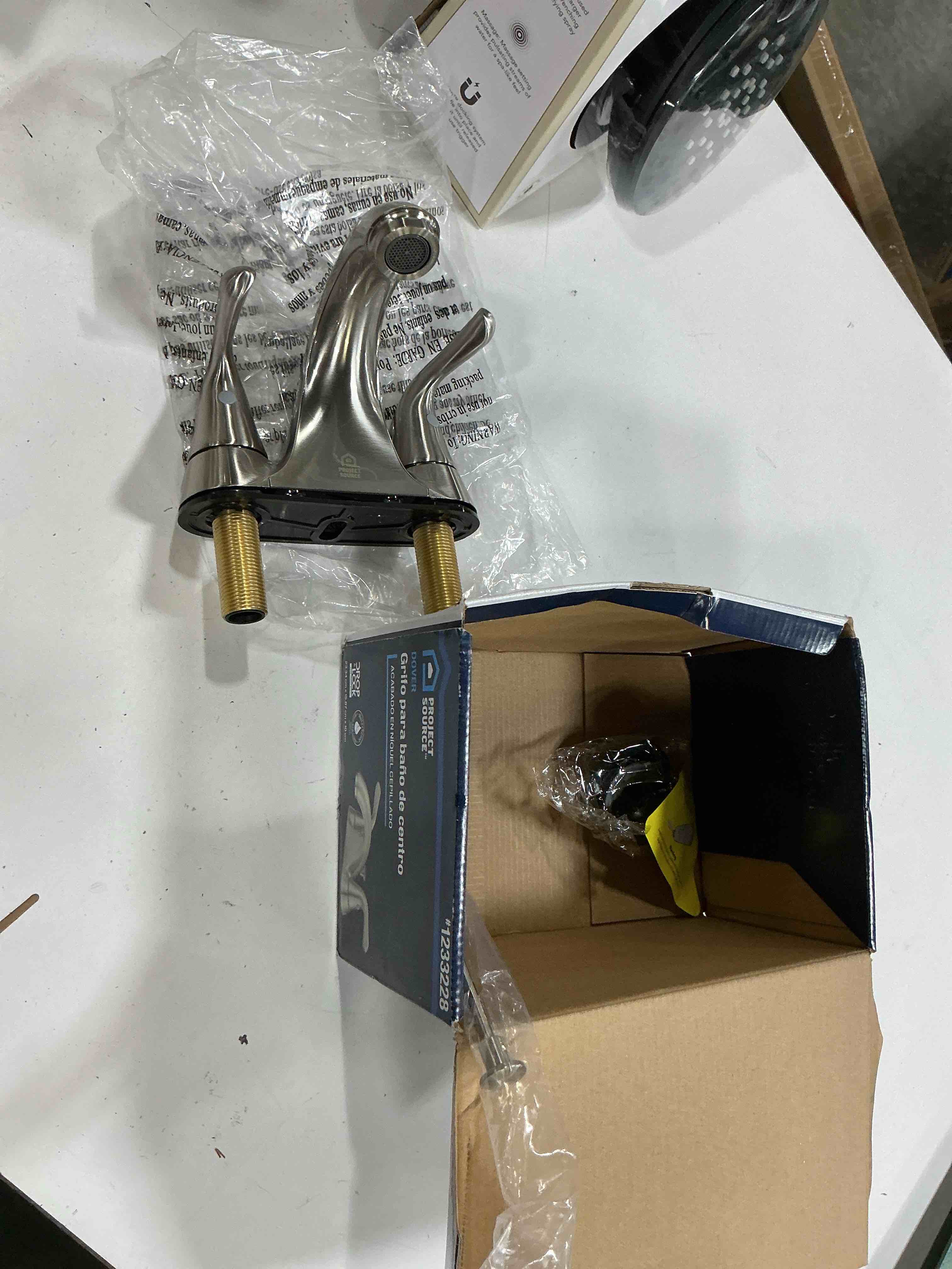 Condition photo showing As Is for dover brushed nickel 4-in centerset 2-handle watersense mid-arc