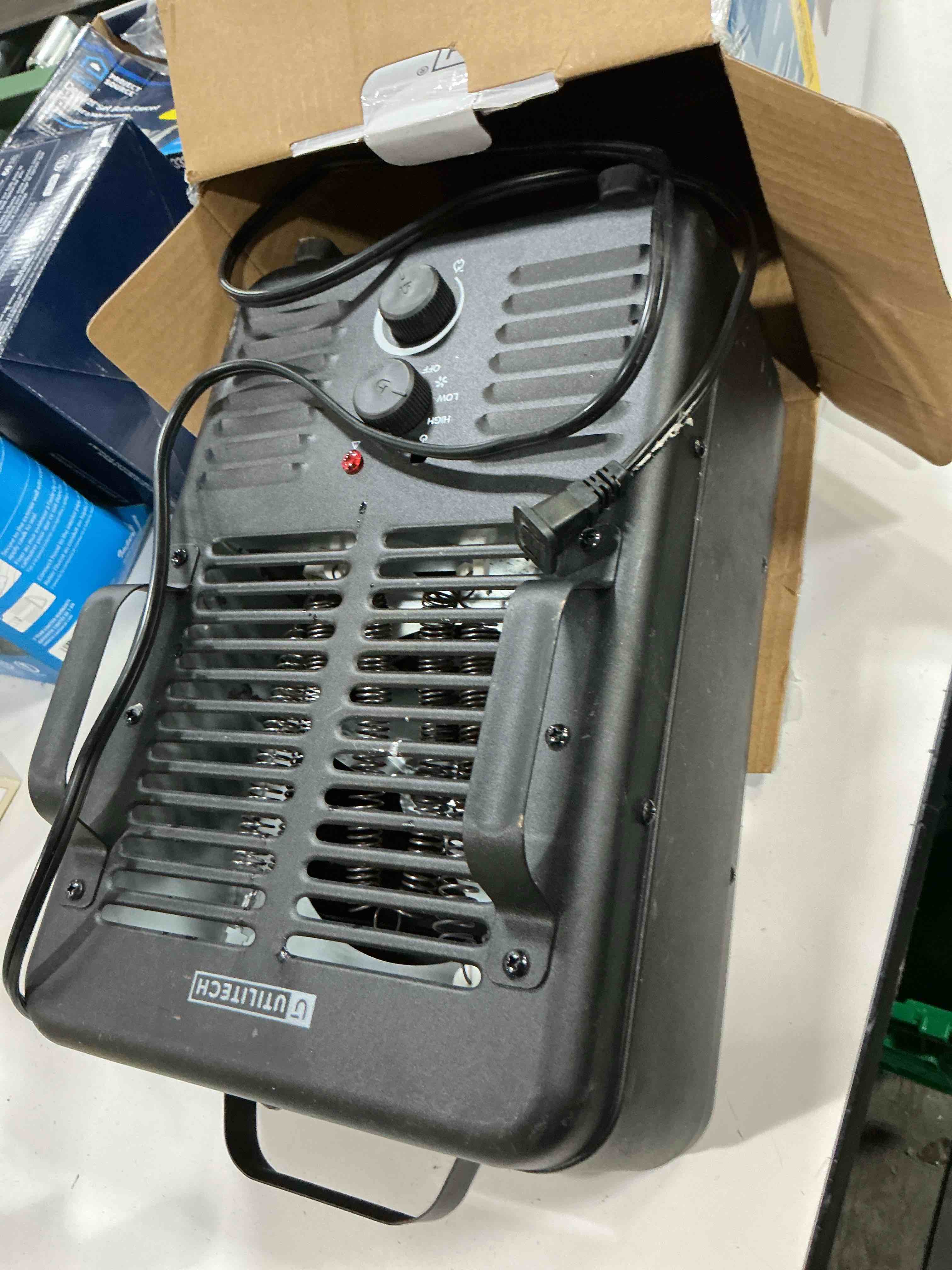 Condition photo showing As Is for utilitech 1500 -watt utility fan utility indoor electric space heater with thermostat