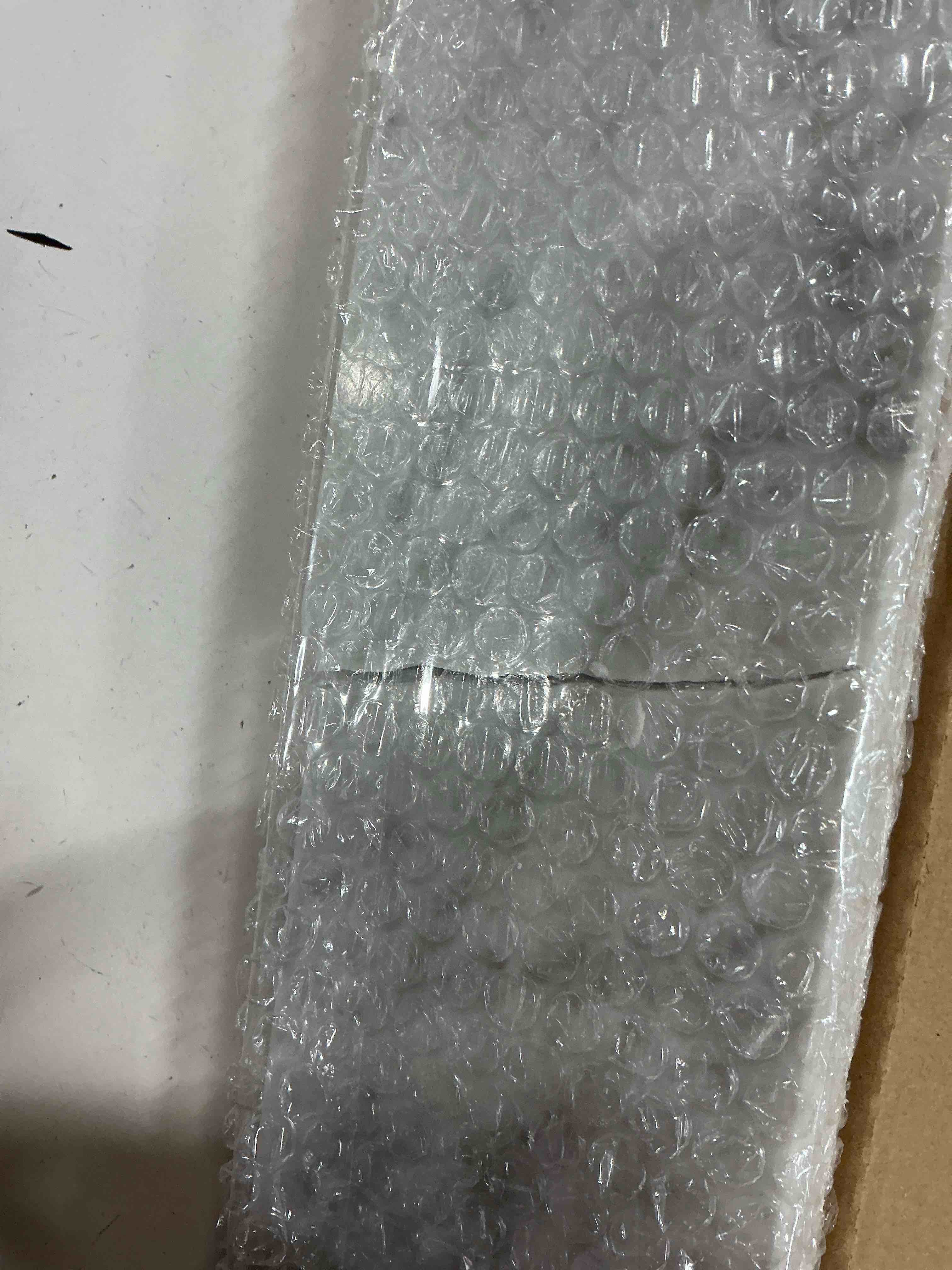 Condition photo showing As Is for allen + roth 4-in h x 21-in l carrara natural marble bathroom side splash