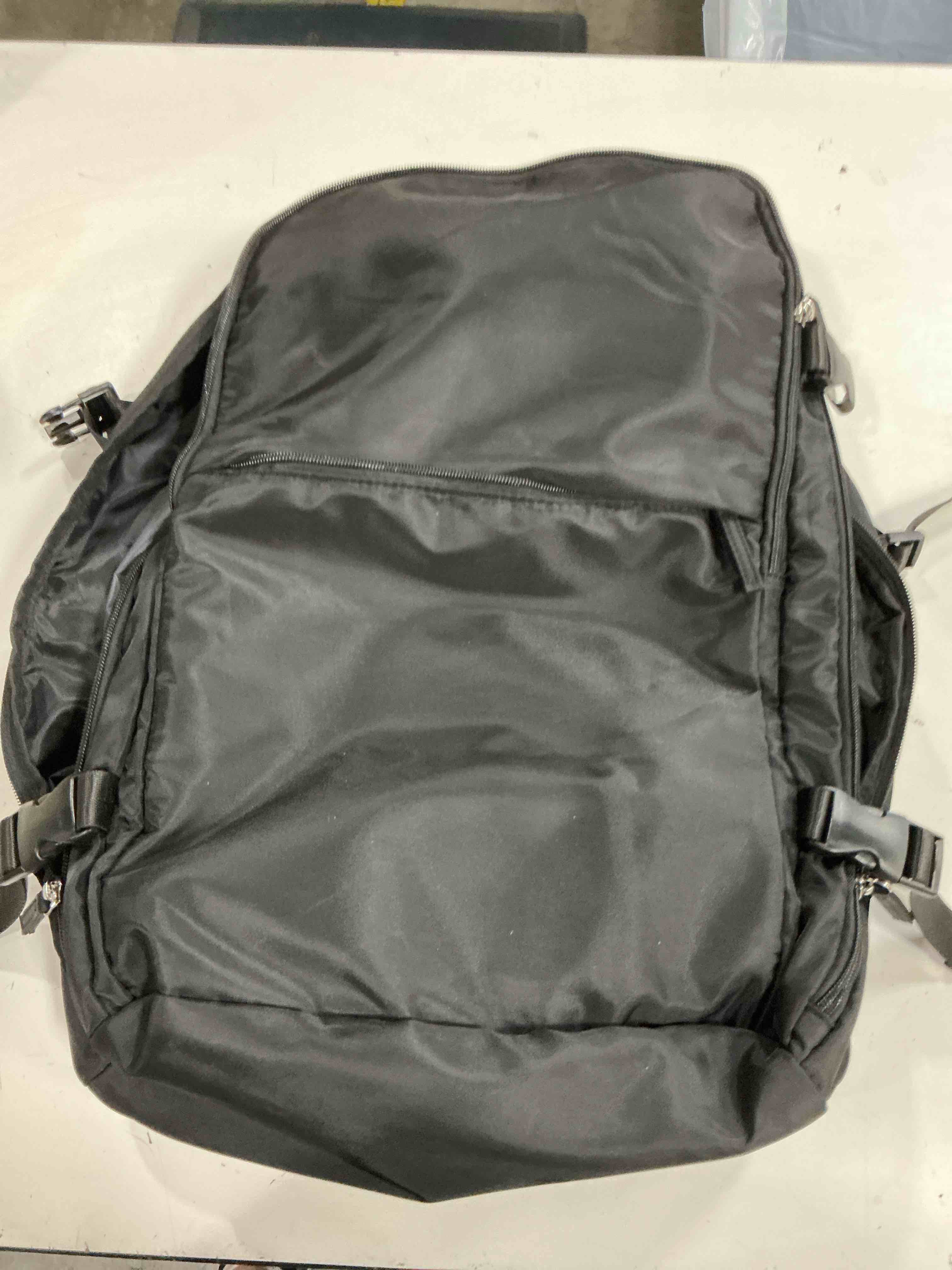 Condition photo showing Good Condition for black tactical backpack features an integrated grey hydration bladder