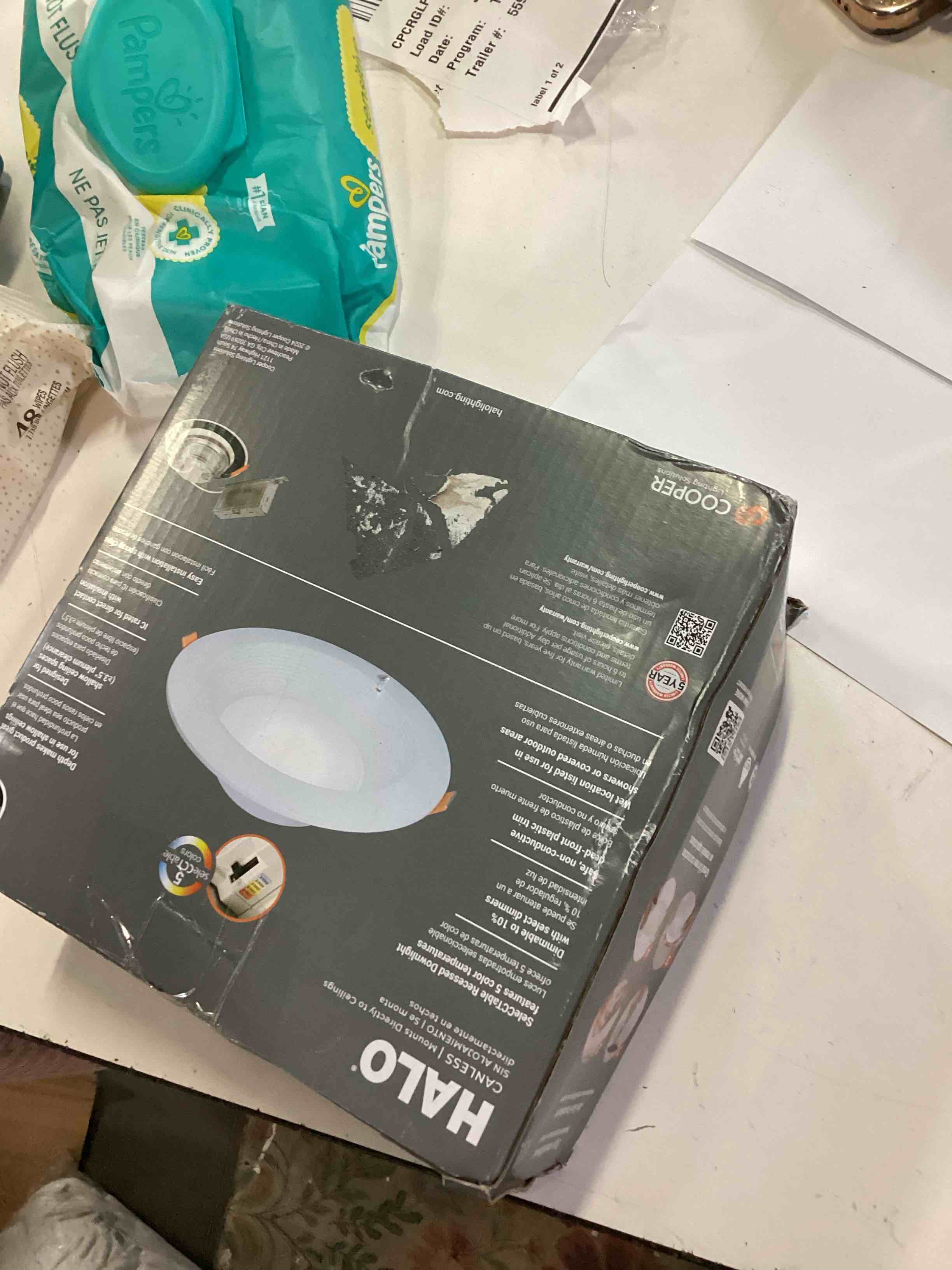 Condition photo showing As Is for halo matte white 6 inch lt recessed canless led downlight dimmable