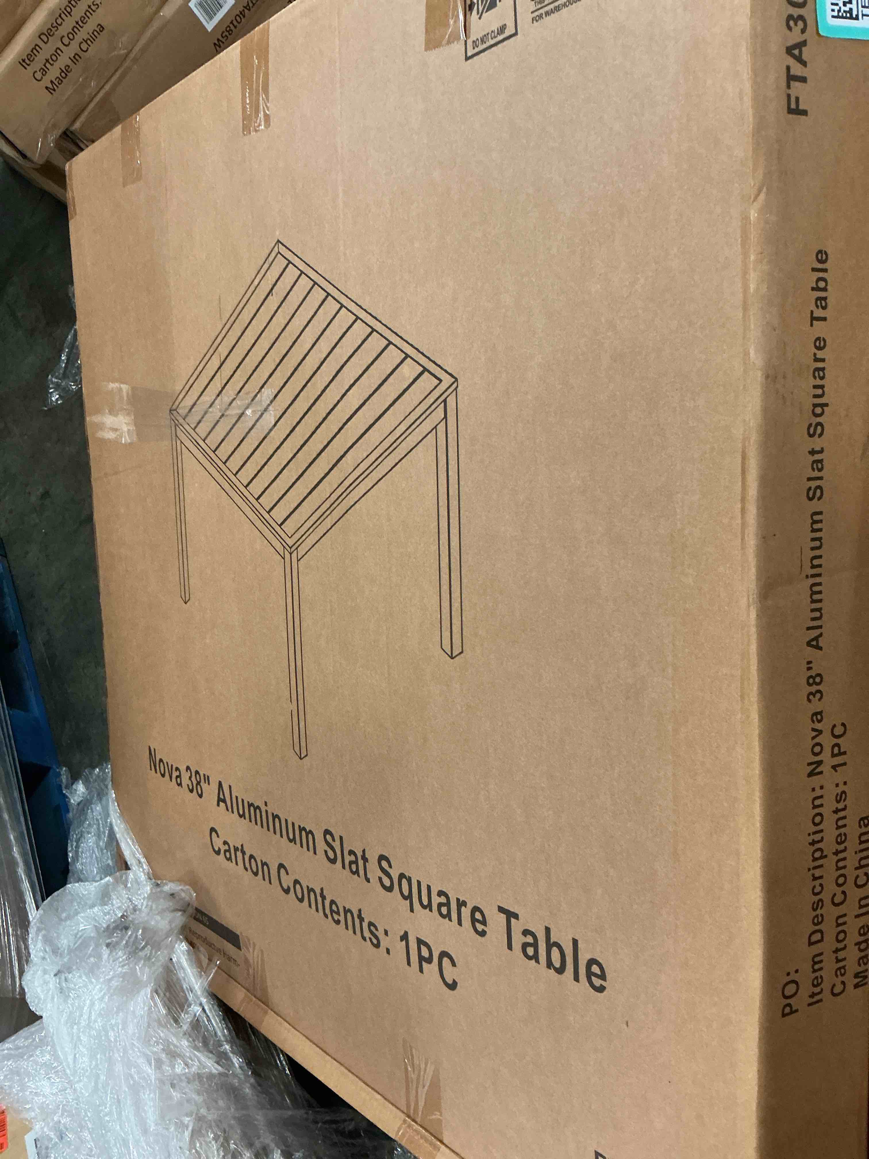 Condition photo showing New/Like New for hanover naples 38" square outdoor aluminum slat dining table, gray, all-weather, 1 piece