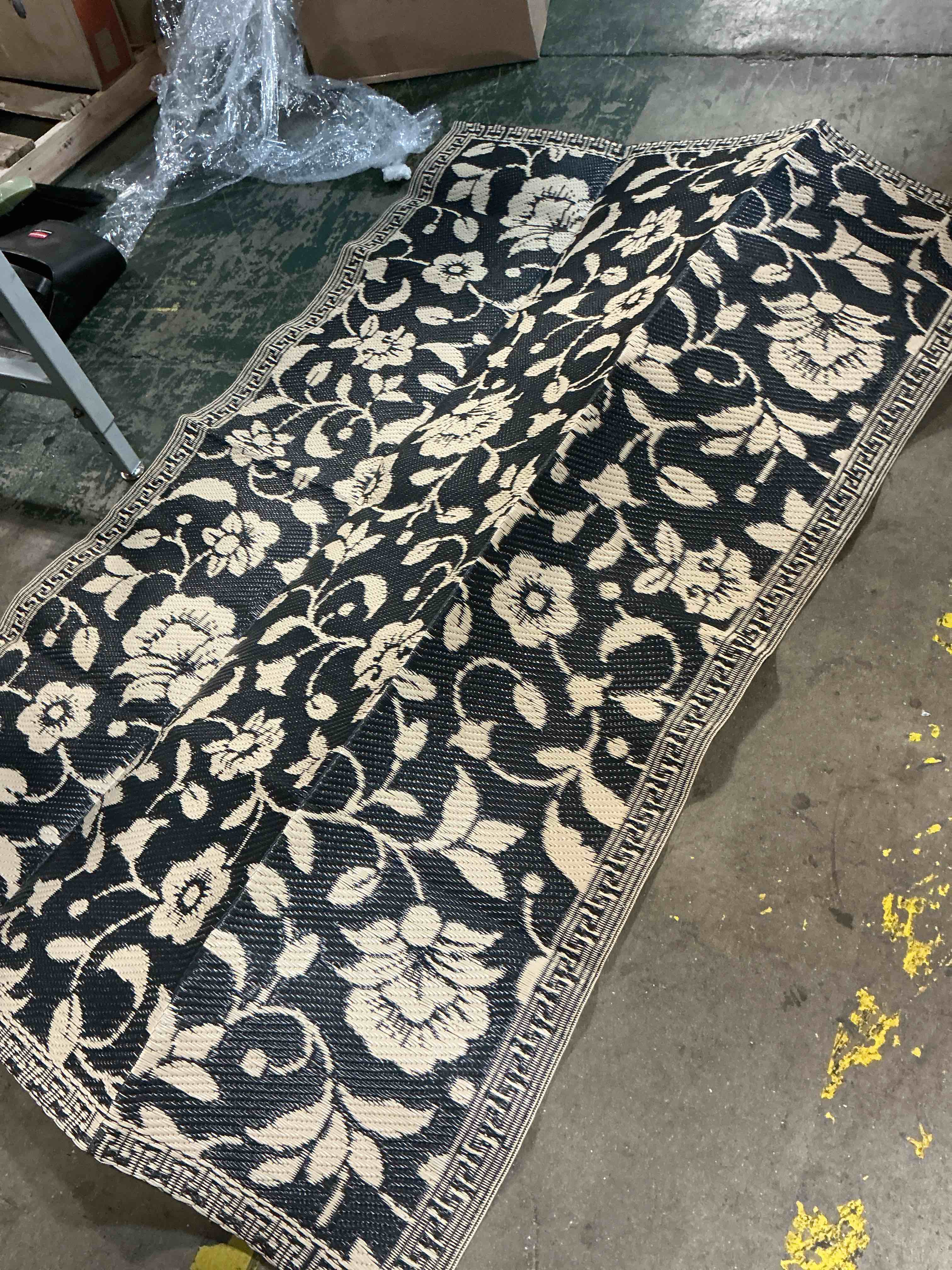 Condition photo showing As Is for olanly waterproof outdoor rug 4x6 ft, outdoor plastic straw rug with flower pattern, reversible rv mat for patio, camping, balcony, deck, backyard, black & white