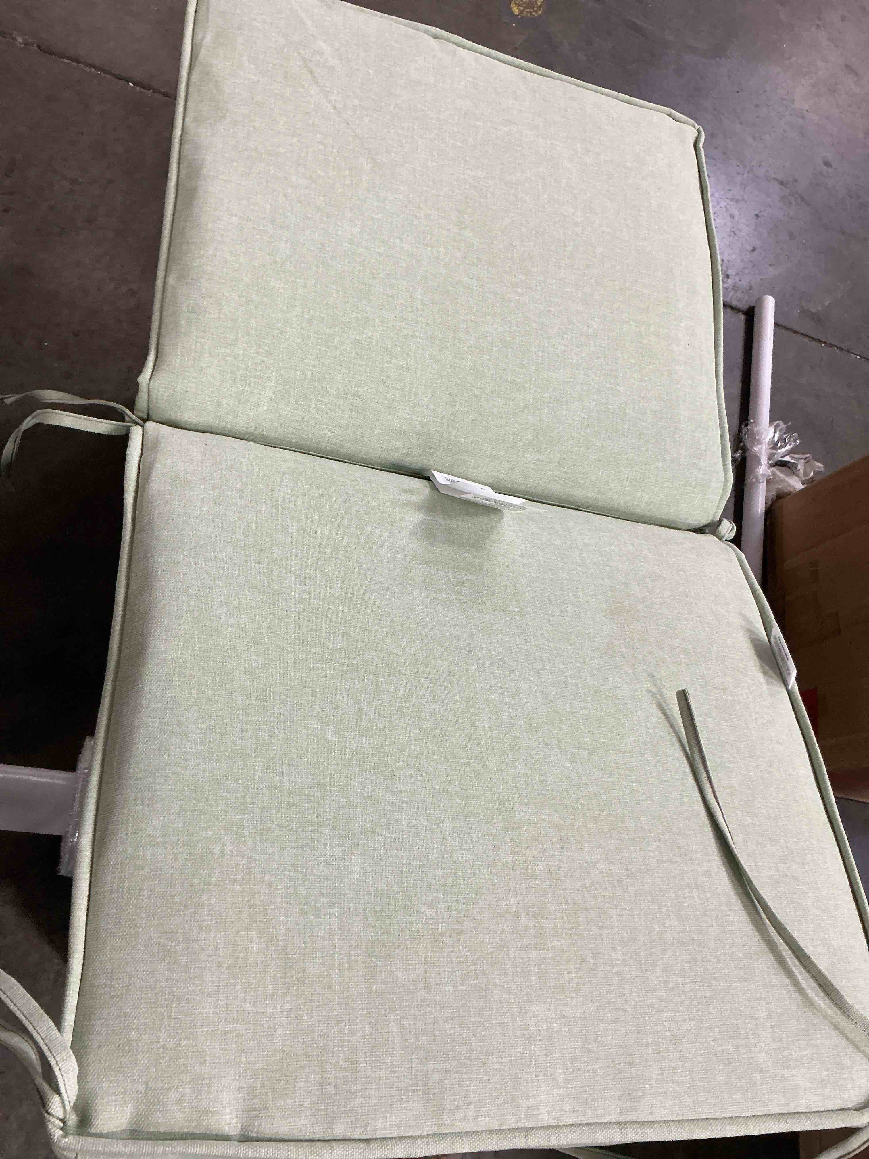 Condition photo showing Good Condition for 20 in. w x 17 in. d cushionguard mid back dining chair outdoor universal cushion in green clay