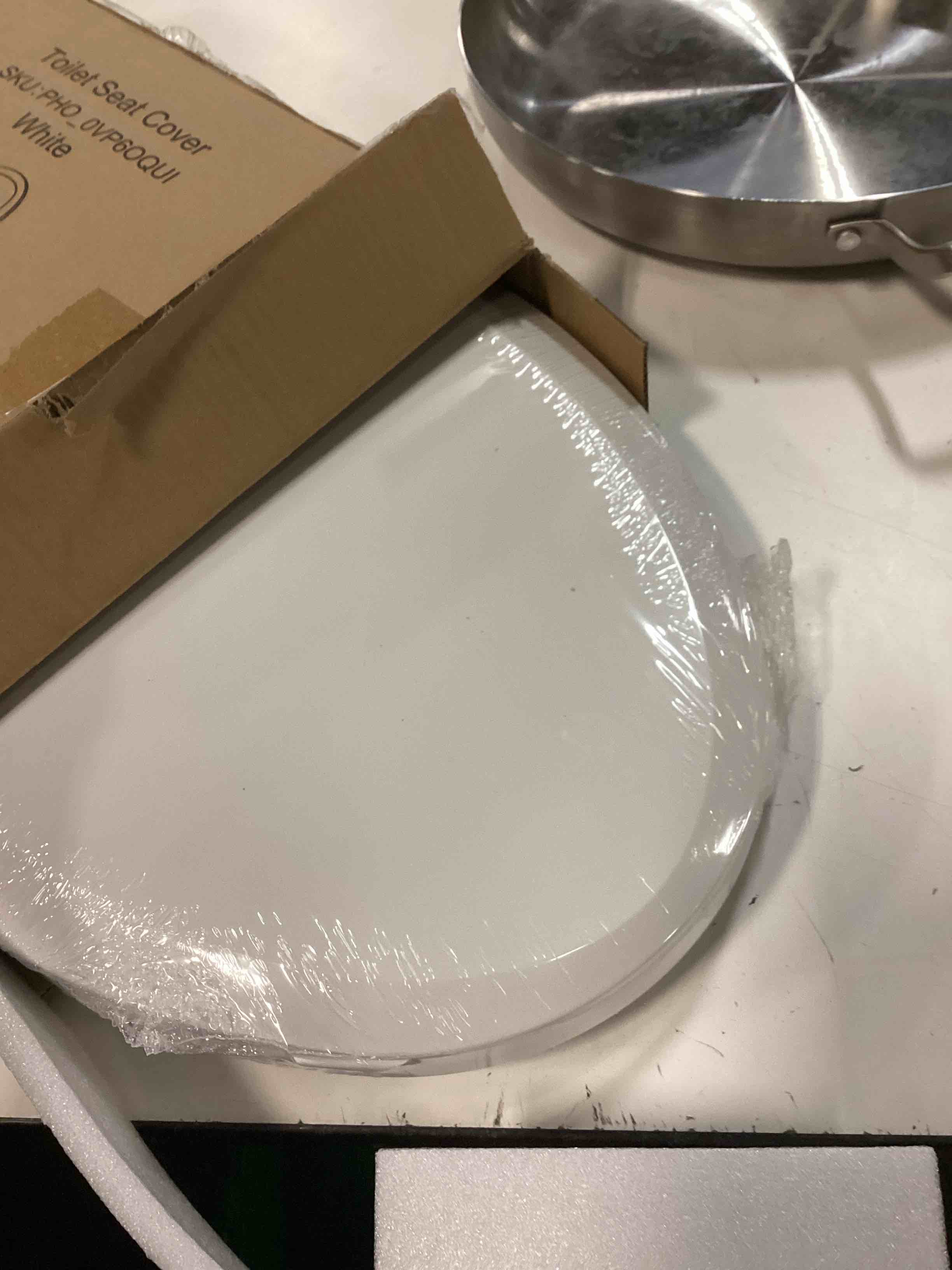 Condition photo showing Good Condition for 19" elongated toilet seat with built-in potty training seat, soft quiet-close lid with non-slip design, magnetic kids seat in white, easy to install and clean elongated (19?) white, with toddler seat