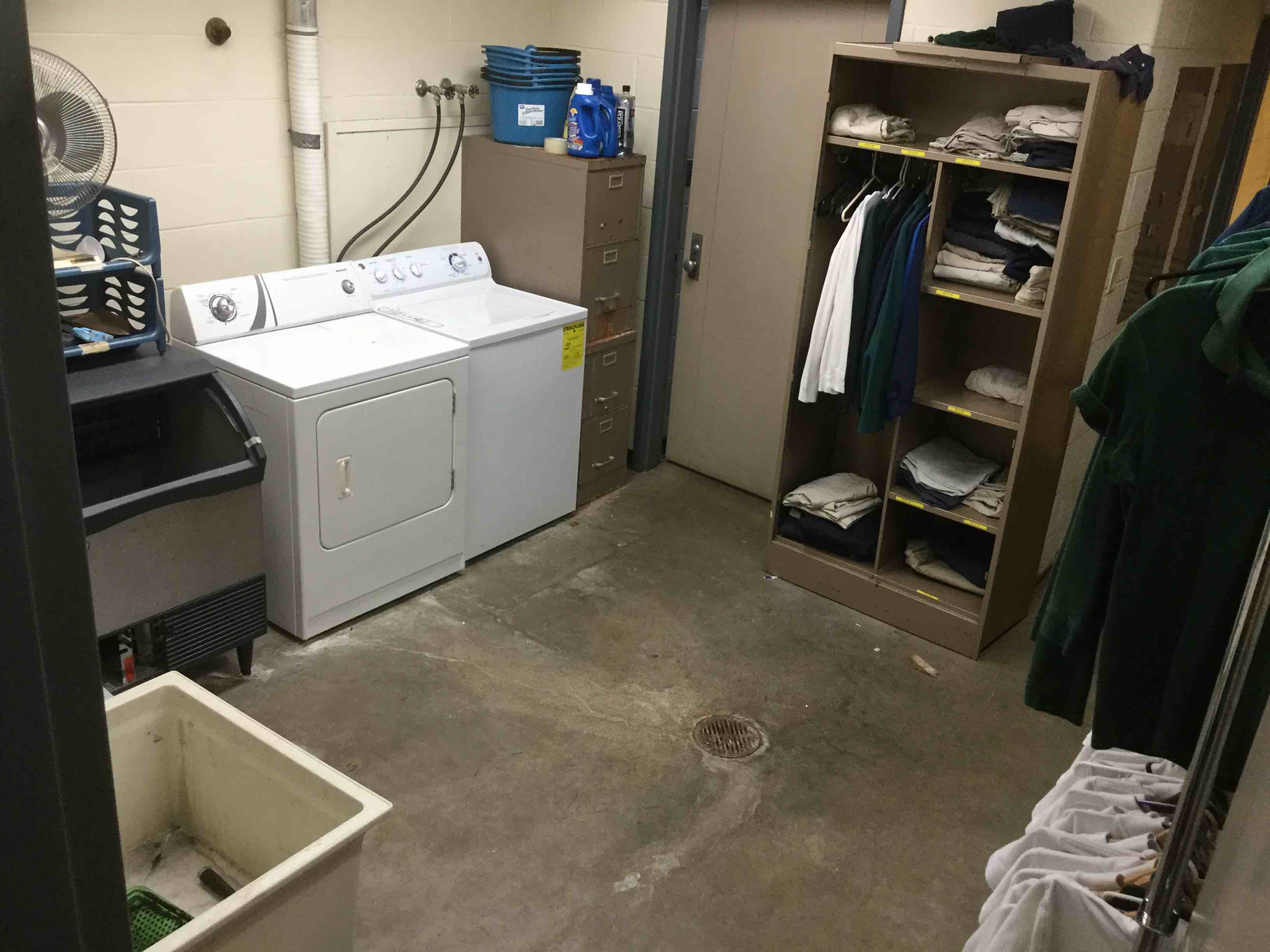 Laundry Room Inside Locker Room Contents To Include Washer, Dryer, Cabinets, Ice Machine, Sink, Garment Racks, Shelving Unit, Light Fixtures And Door (Clothing Contents Not Included On Racks And Shelves)