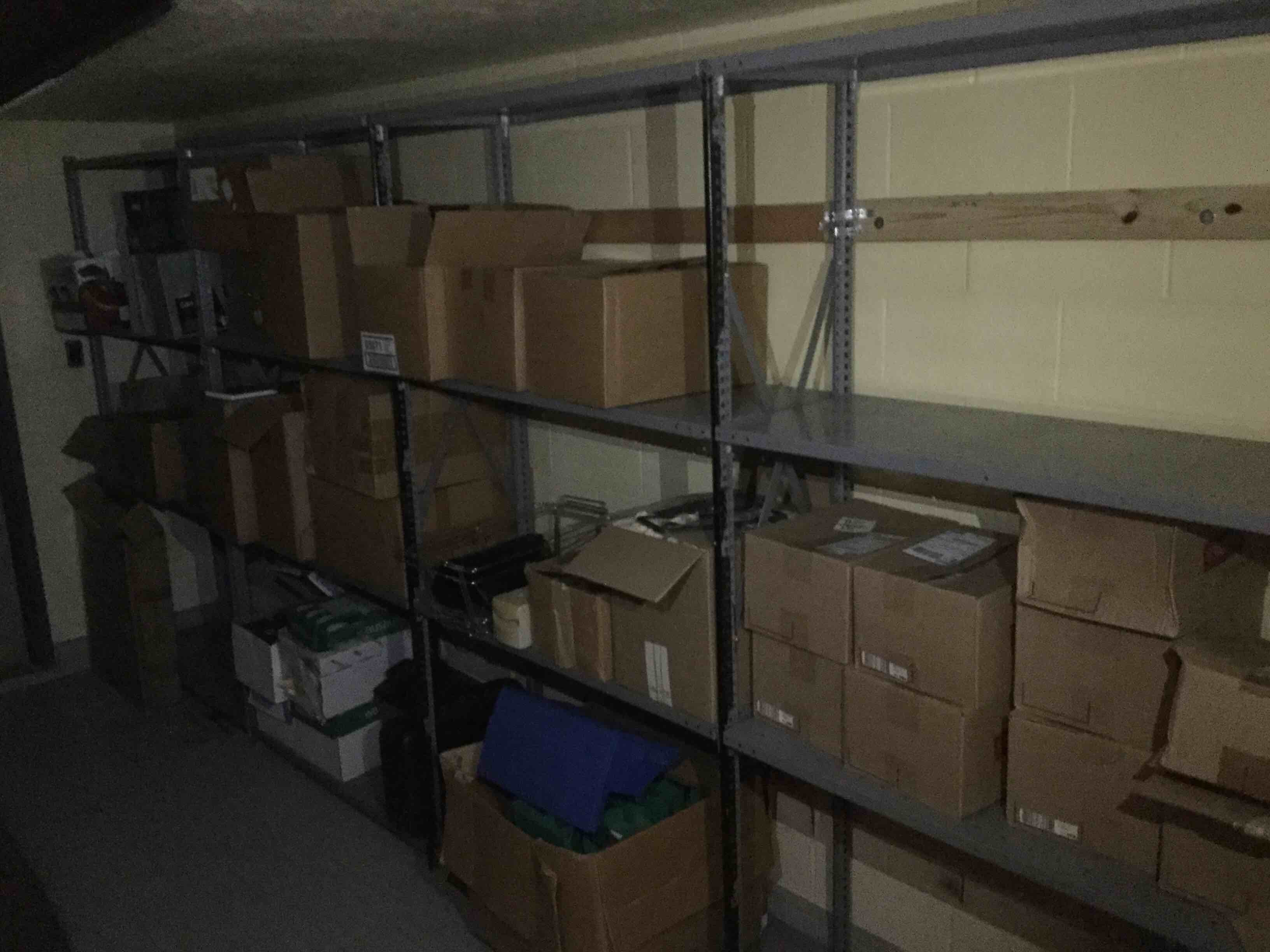 Locker Room Storage To Contain (6)Metal Shelving Units, Entry Door, And Lockers(Contents On Shelves Not Included)