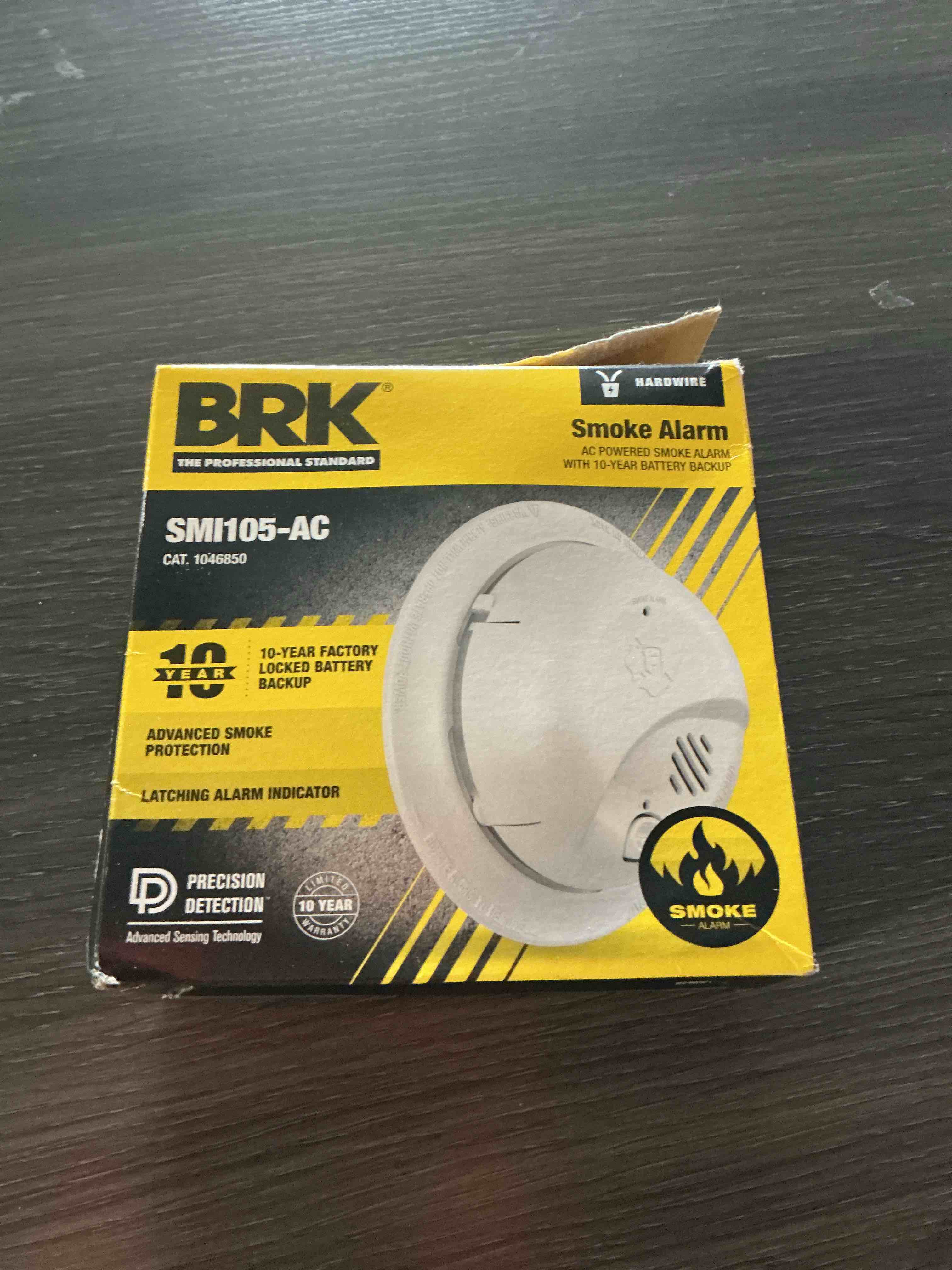 Condition photo showing As Is for first alert smoke alarm, interconnect hardwire detector with 10-year battery backup, smi105-ac