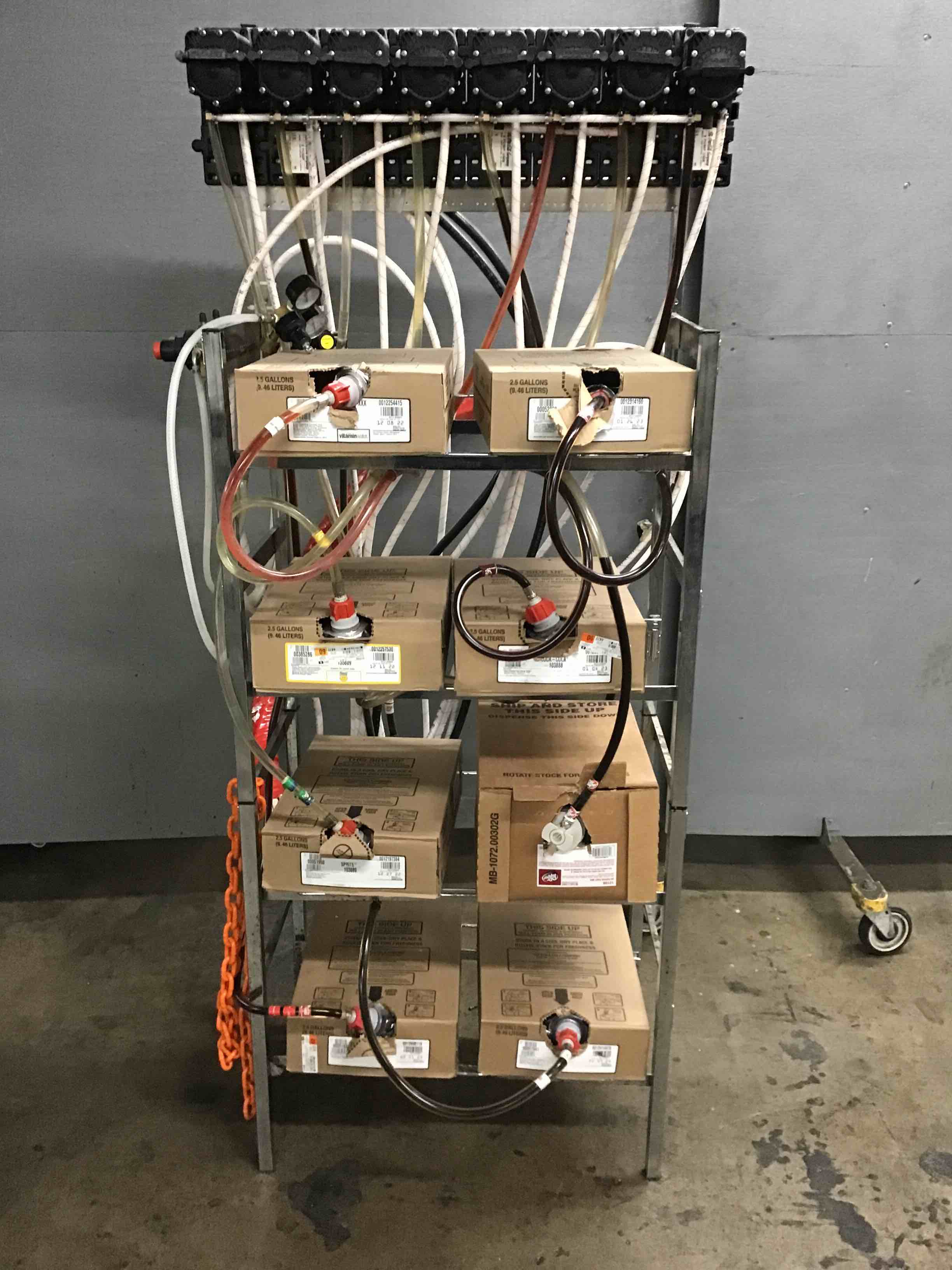 SODA FOUNTAIN SYRUP RACK WITH ASSORTED SYRUP