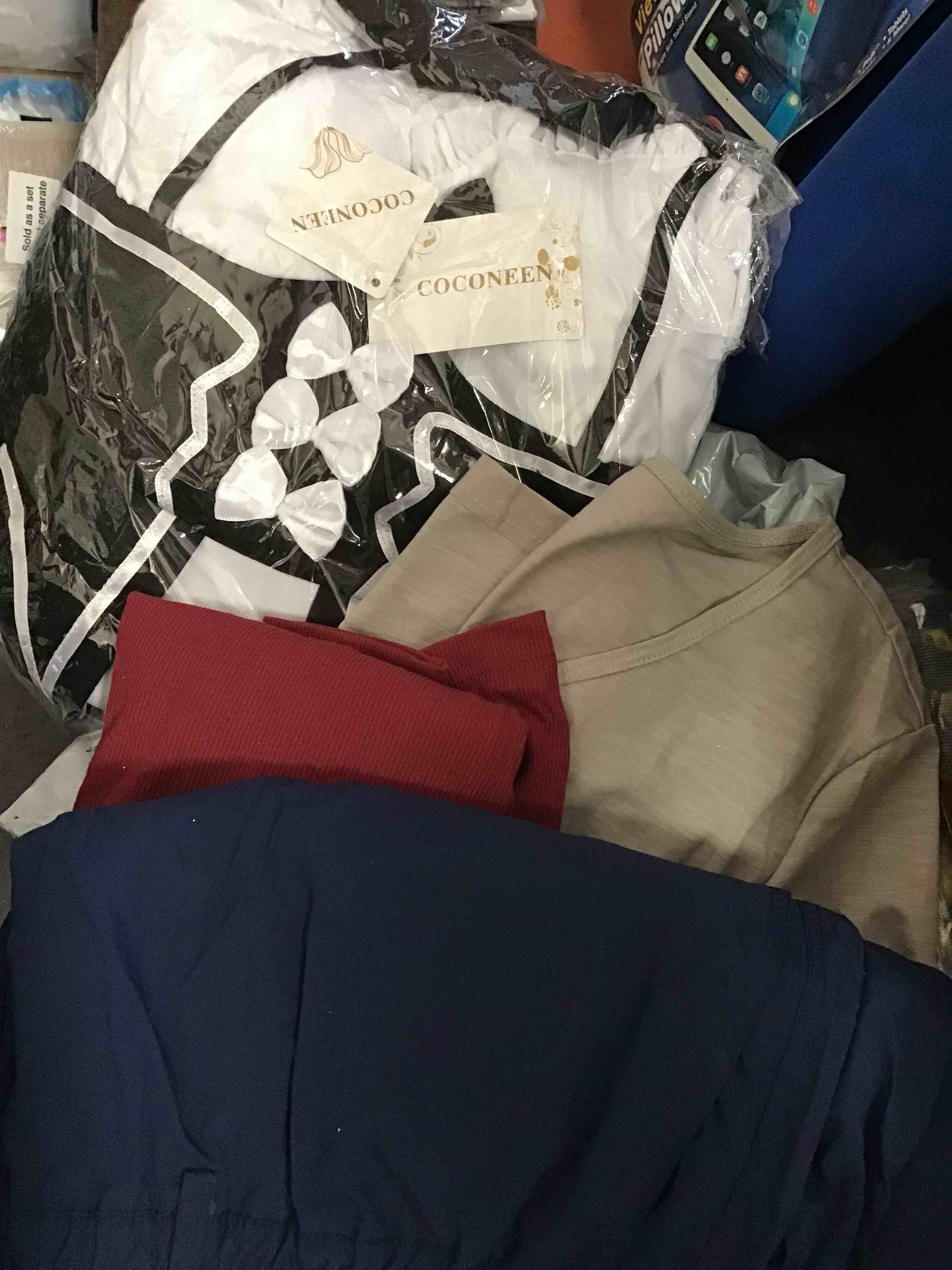 Assortment of clothes of different style and size.