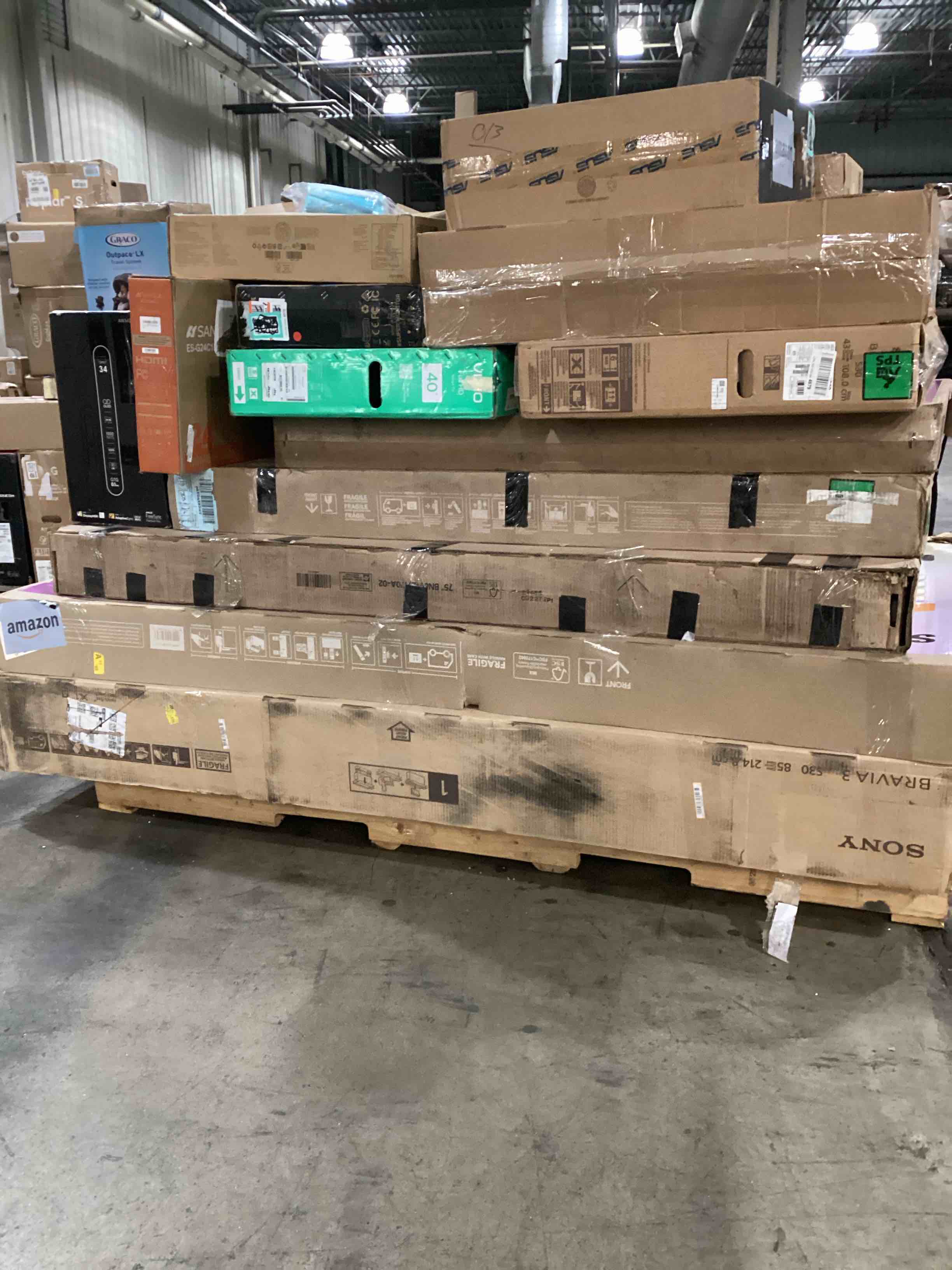 Condition photo showing As Is for pallet of defective electronics for parts