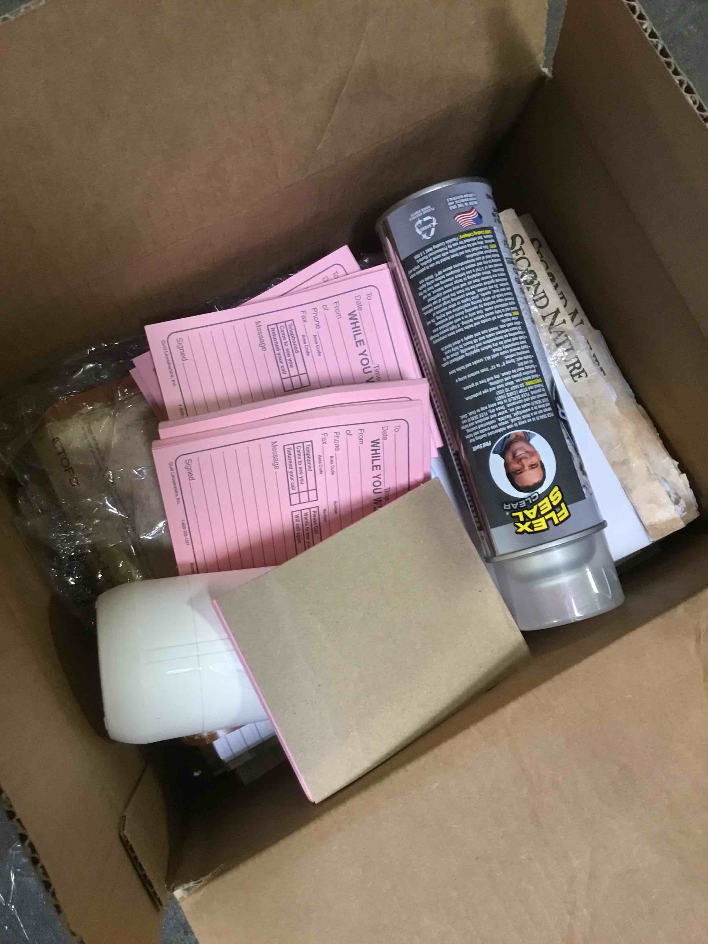 Box of assorted office supplies including paper , sprays memo books and more