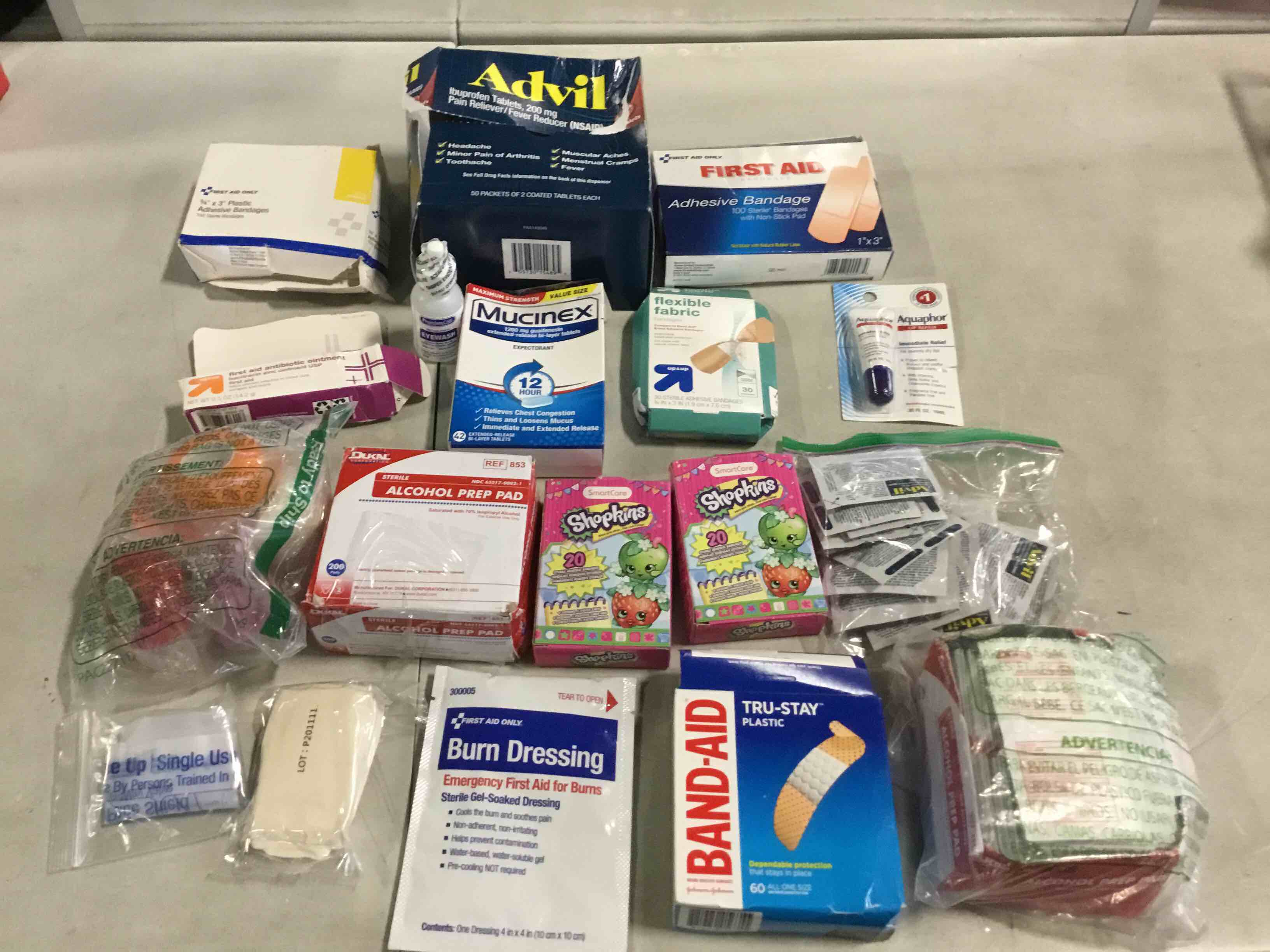 Assorted Medicines Include: Advil, Mucinex, Eyewash , Alcohol Pads, Bandages