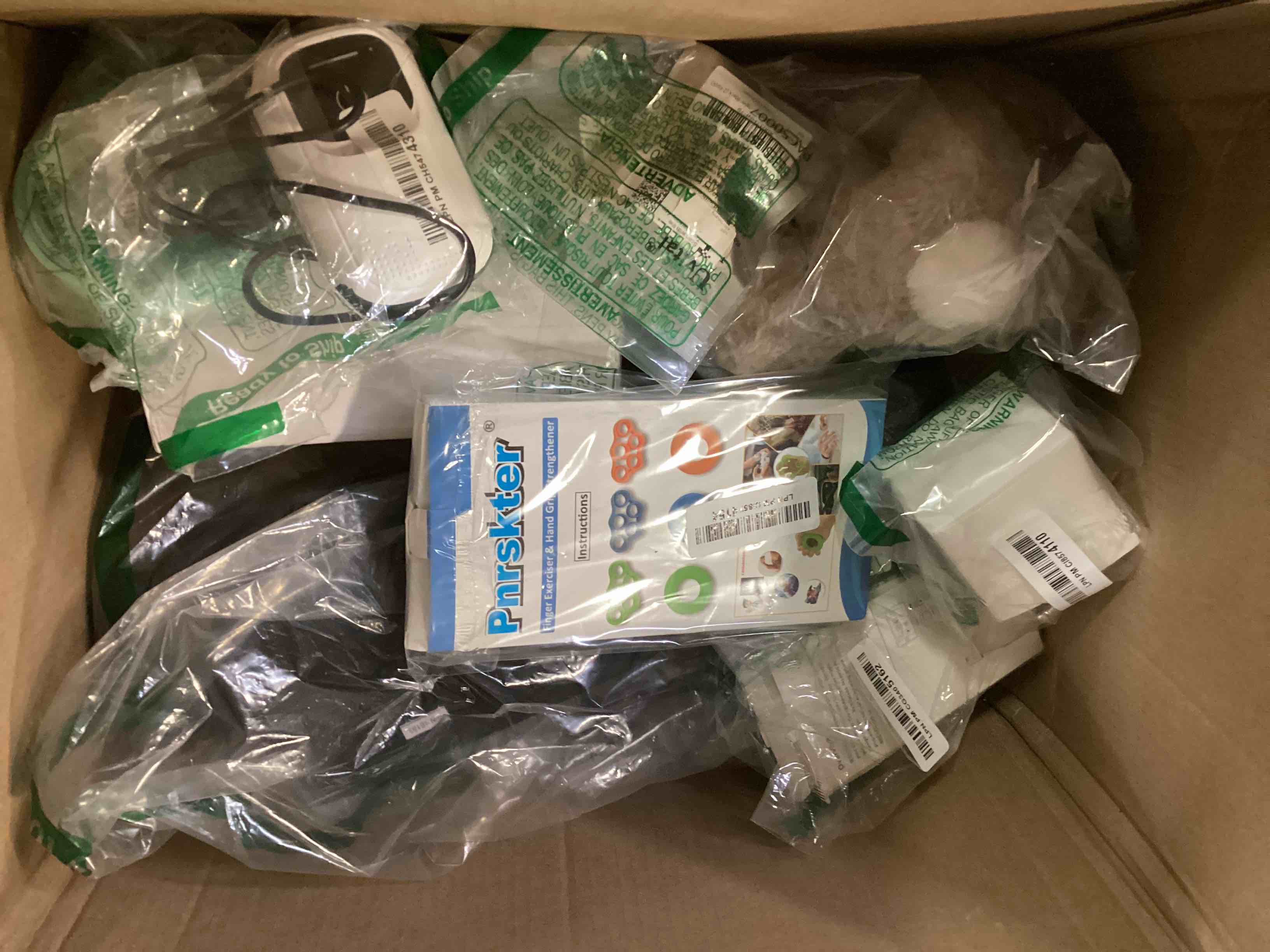 Assorted miscellaneous includes Pnrskter exerciser and Iphone wireless carplay and more…