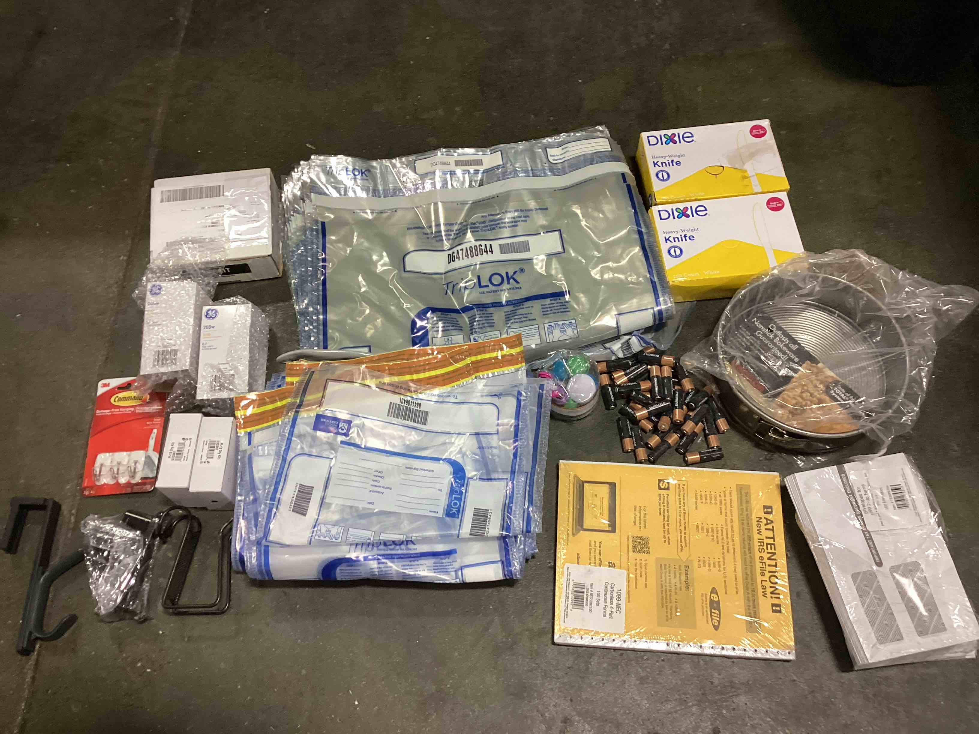 Assorted school and office supplies: AA Duracell batteries, envelopes, knives, light bulbs and more 