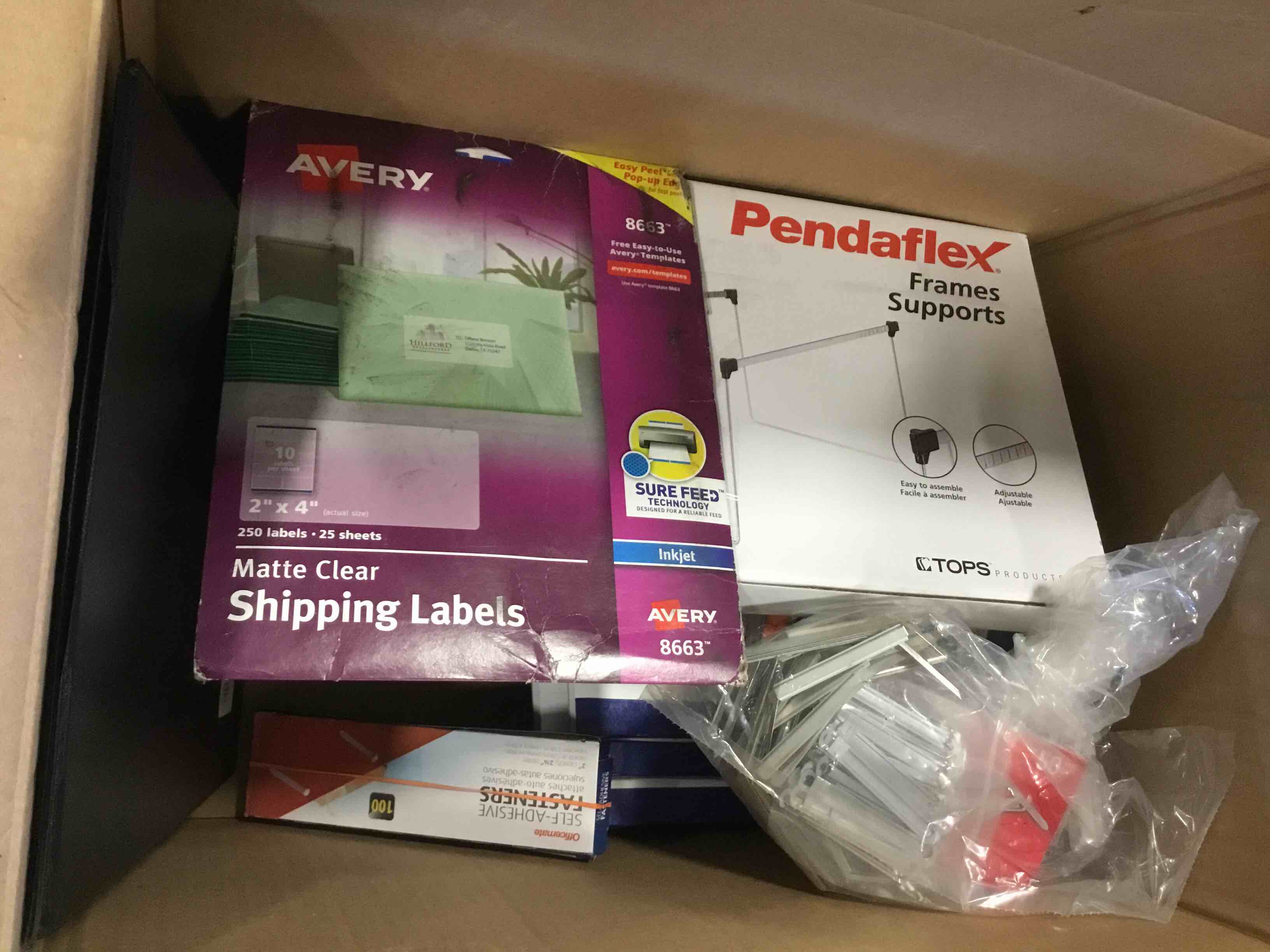 Assorted office supplies: binder, writing pads, avery shipping labels and more 