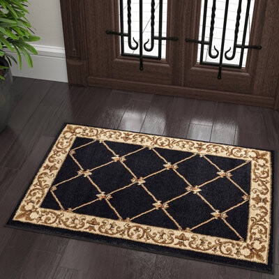 Clarence Oriental Area Rug in Black/Gold