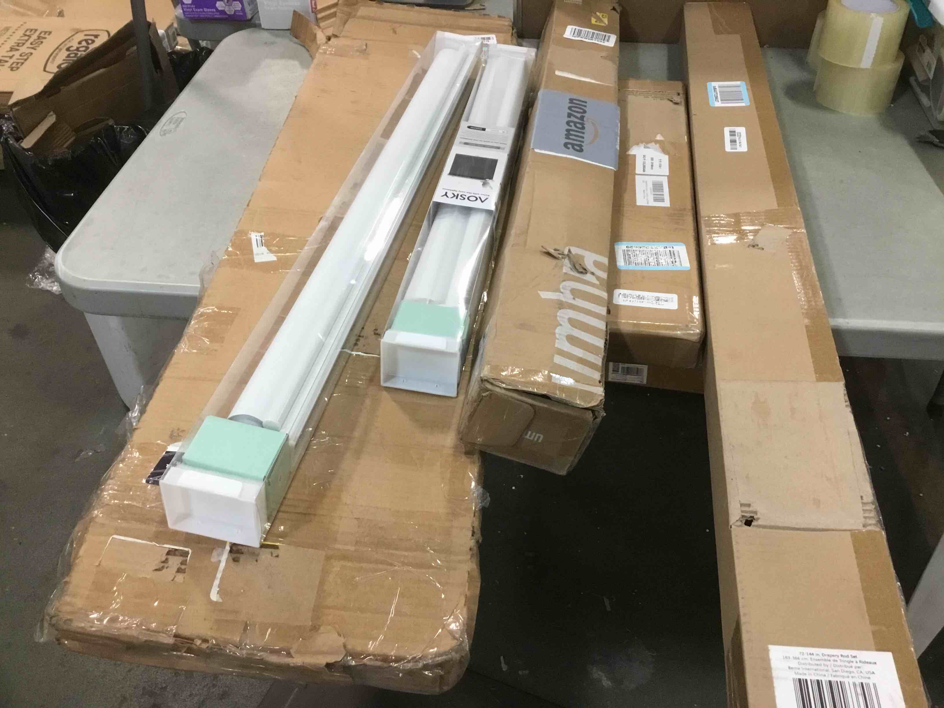 Assorted items including ( Drapery rod set, Cordless roller shade, curtain rod & Vent-visor )